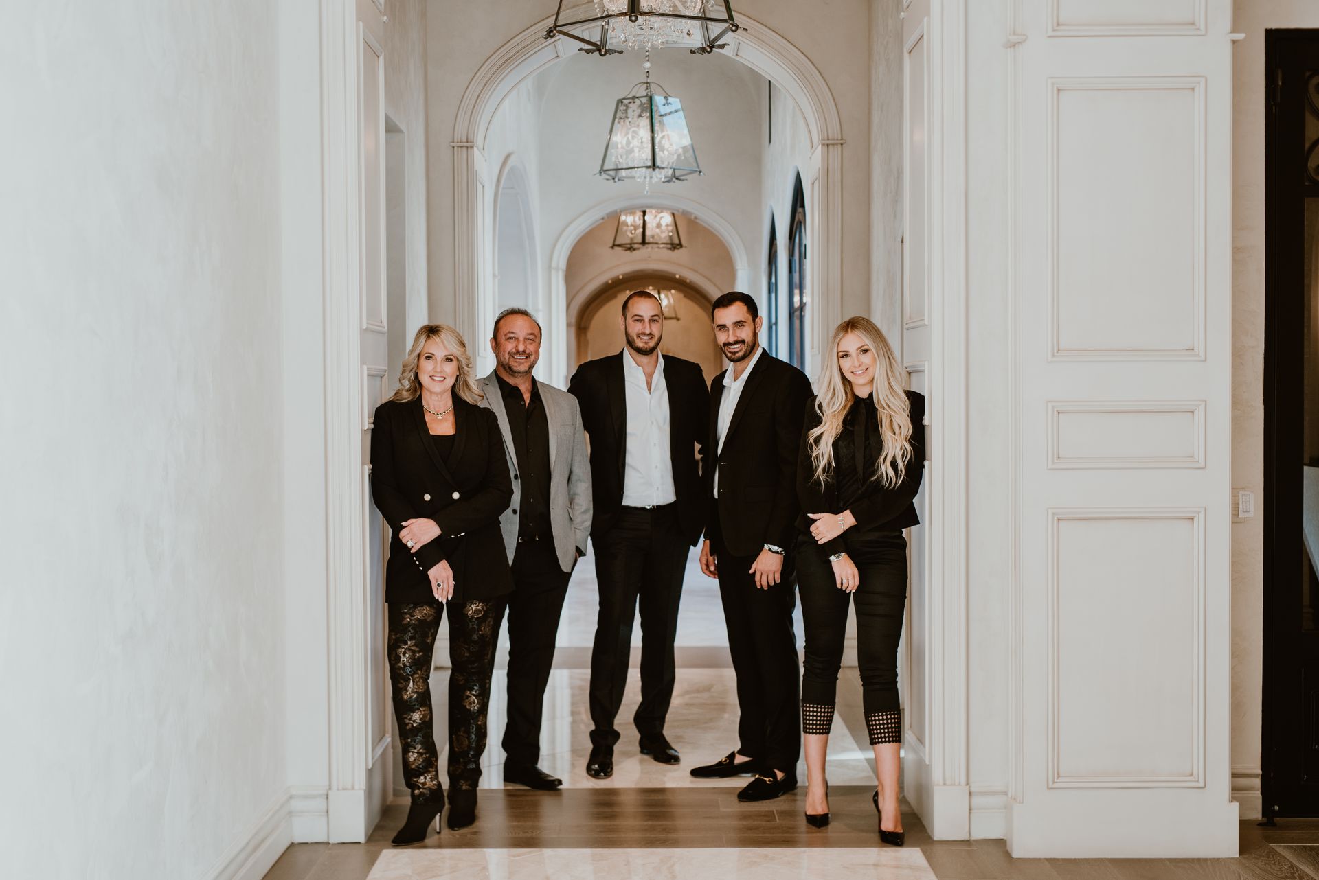 The Fratantoni family, Sam, Josie, Vince, Angelo, and Jessica,standing in a luxury home interior.