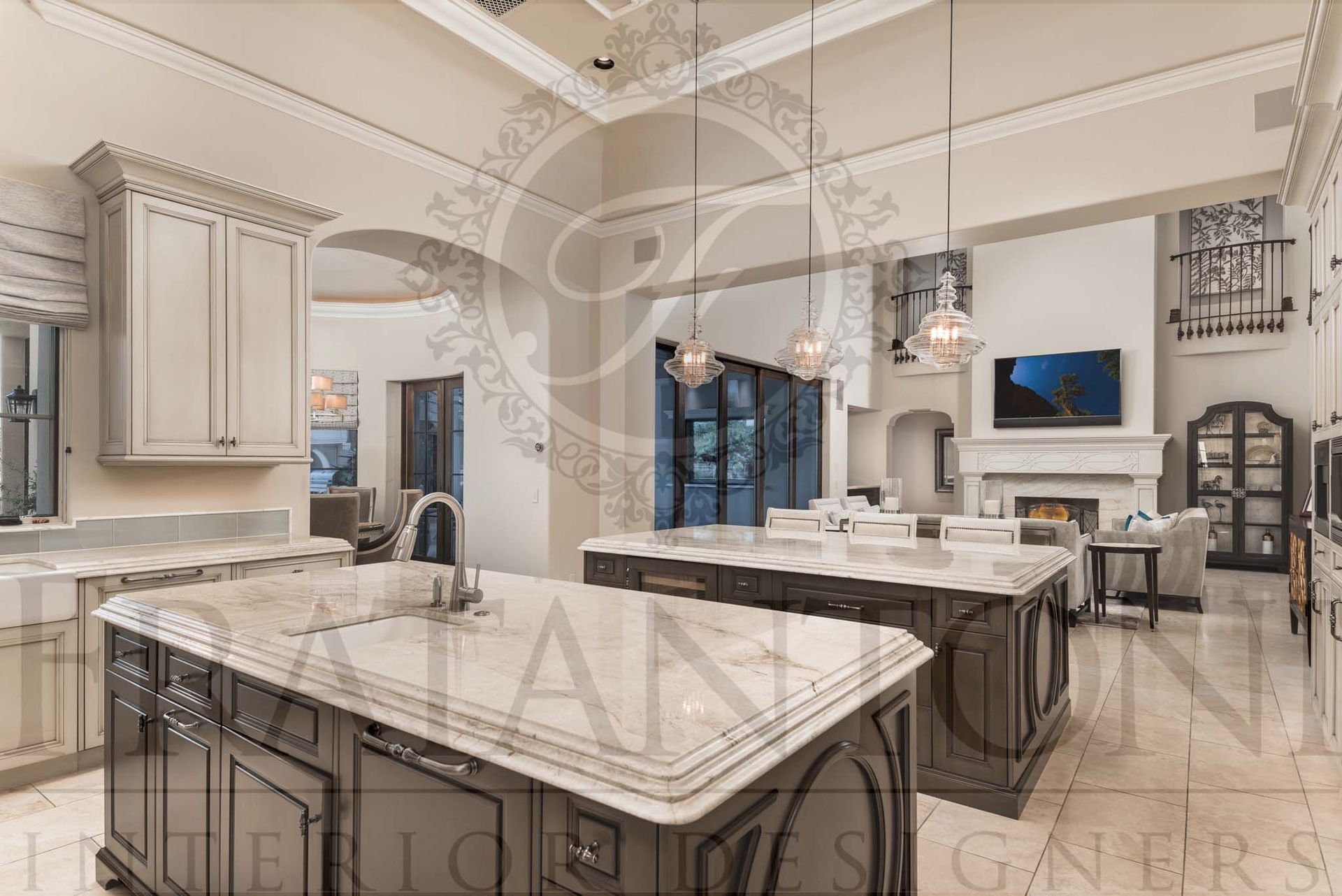 Luxury custom kitchen with double marble islands, hanging glass pendant lights, and intricate ceiling details