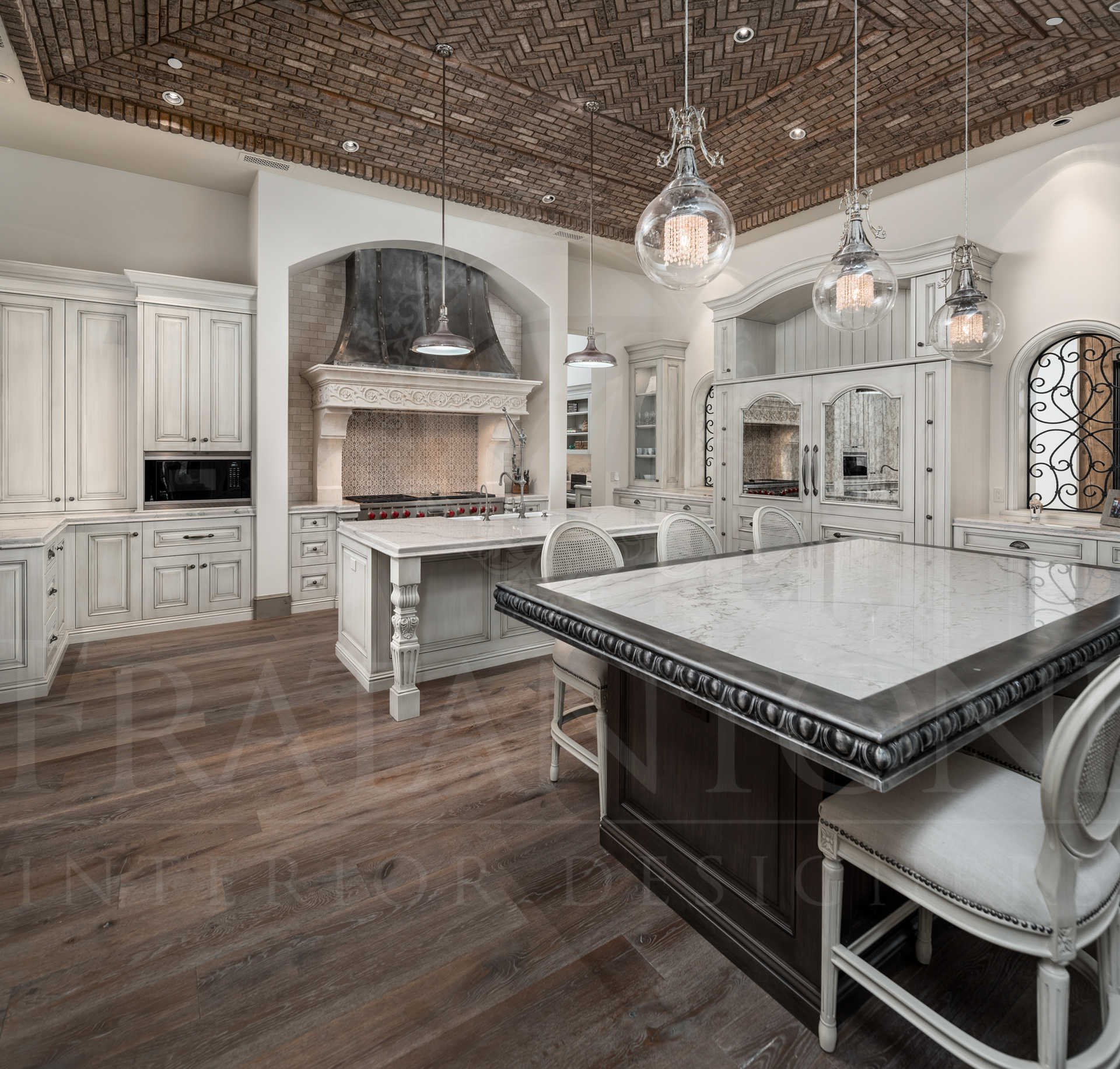Elegant kitchen with white cabinets, dark wood island, patterned brick ceiling, and pendant lights designed by Fratantoni Interior Designers in scottsdale, arizona. 