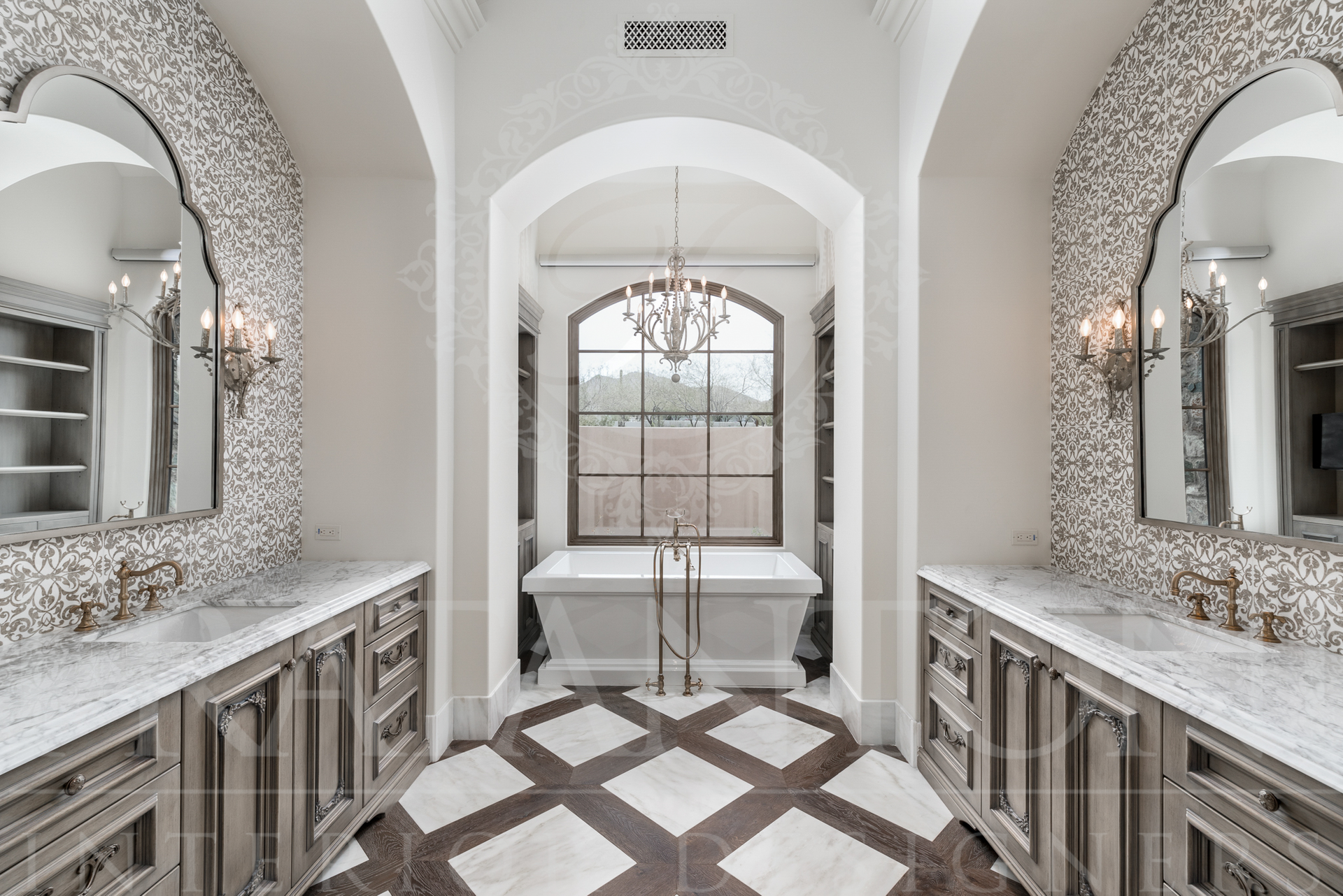 Elegant bathroom with archways, patterned floor, and a freestanding tub designed by Fratantoni Interior Designers in scottsdale Arizona