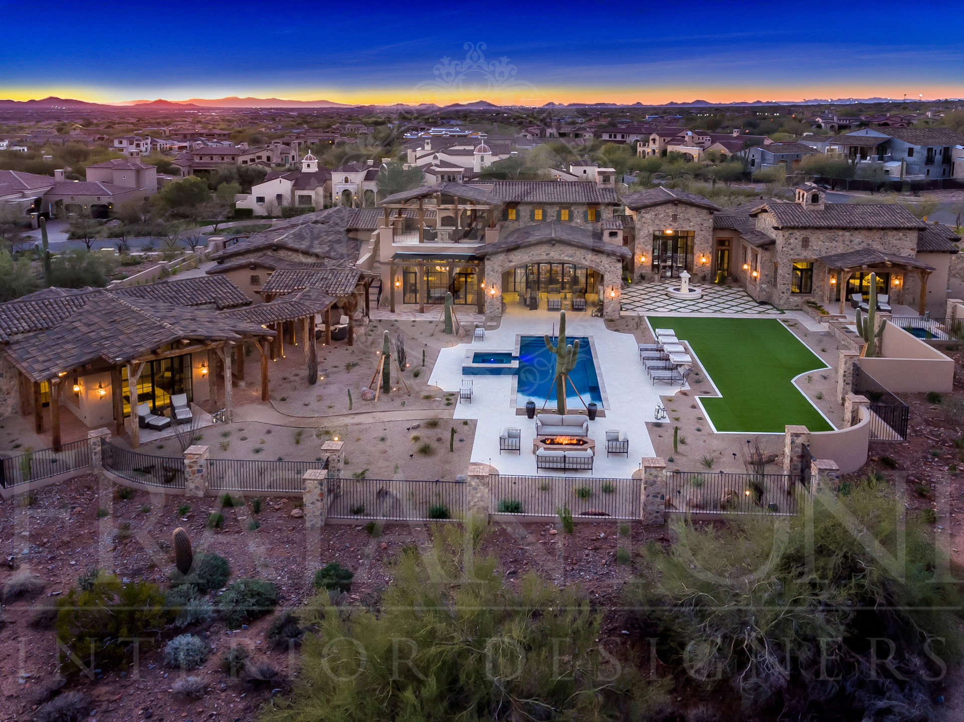 Luxurious arizona desert home with pool and desert landscape at sunset designed by fratantoni interior designers in scottsdale