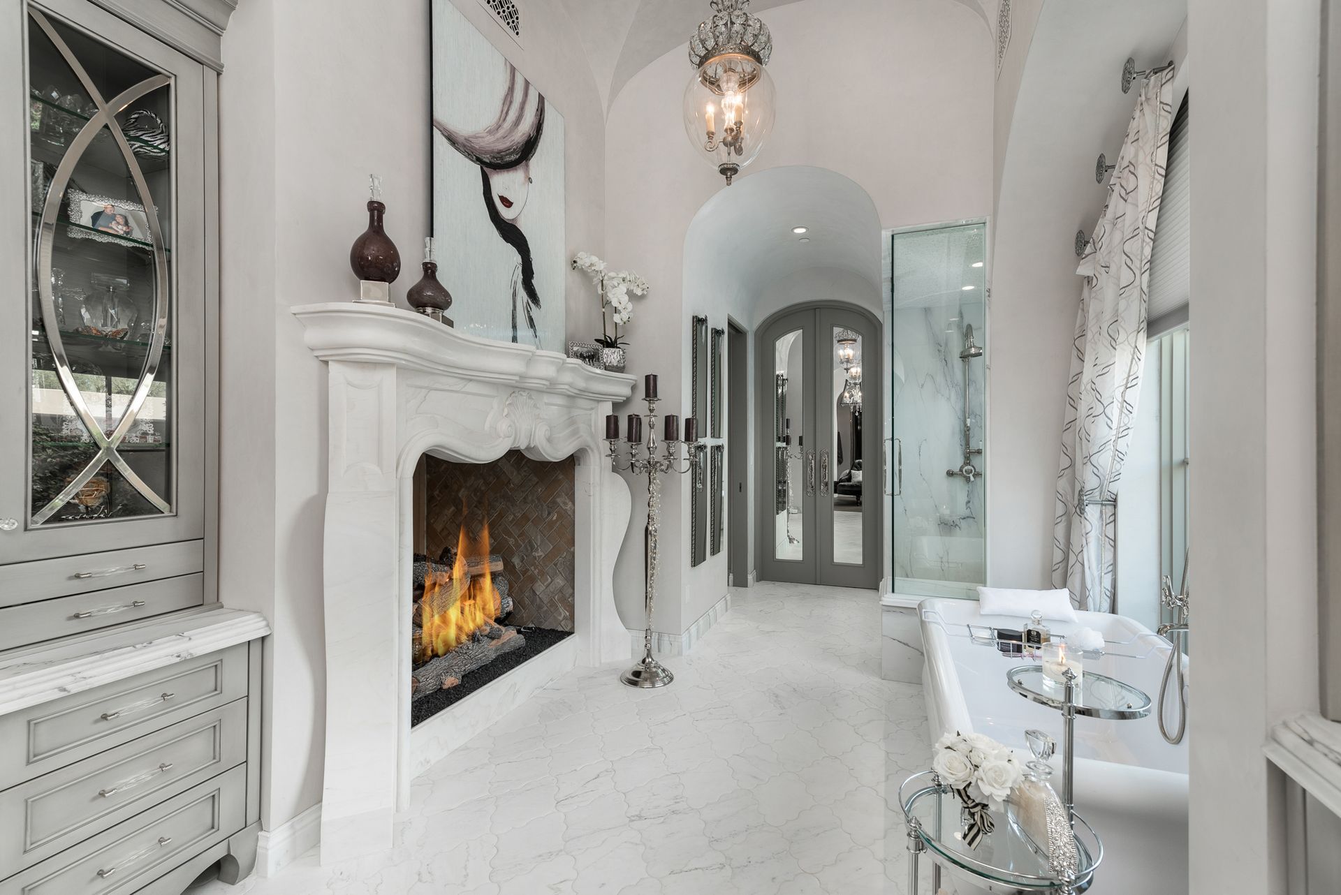 A bathroom with a fireplace and a bathtub.