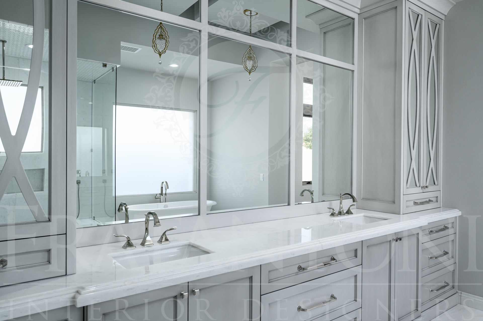 Bright white custom bathroom vanity with double sinks and large mirror detail cabinets by Fratantoni Interior Designers in Scottsdale, AZ.
