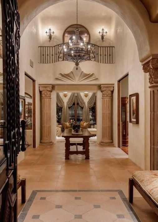 A hallway with a table in the middle of it