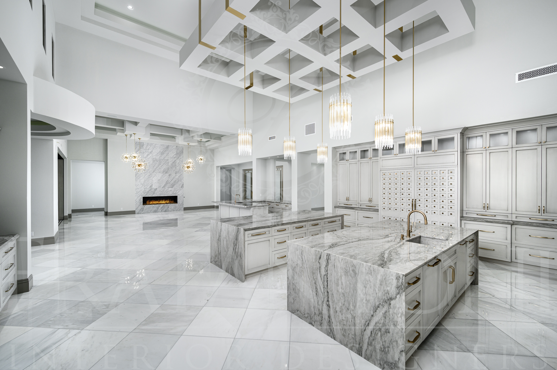 Luxury white marble interior with ornate counters, chandeliers, and a patterned ceiling