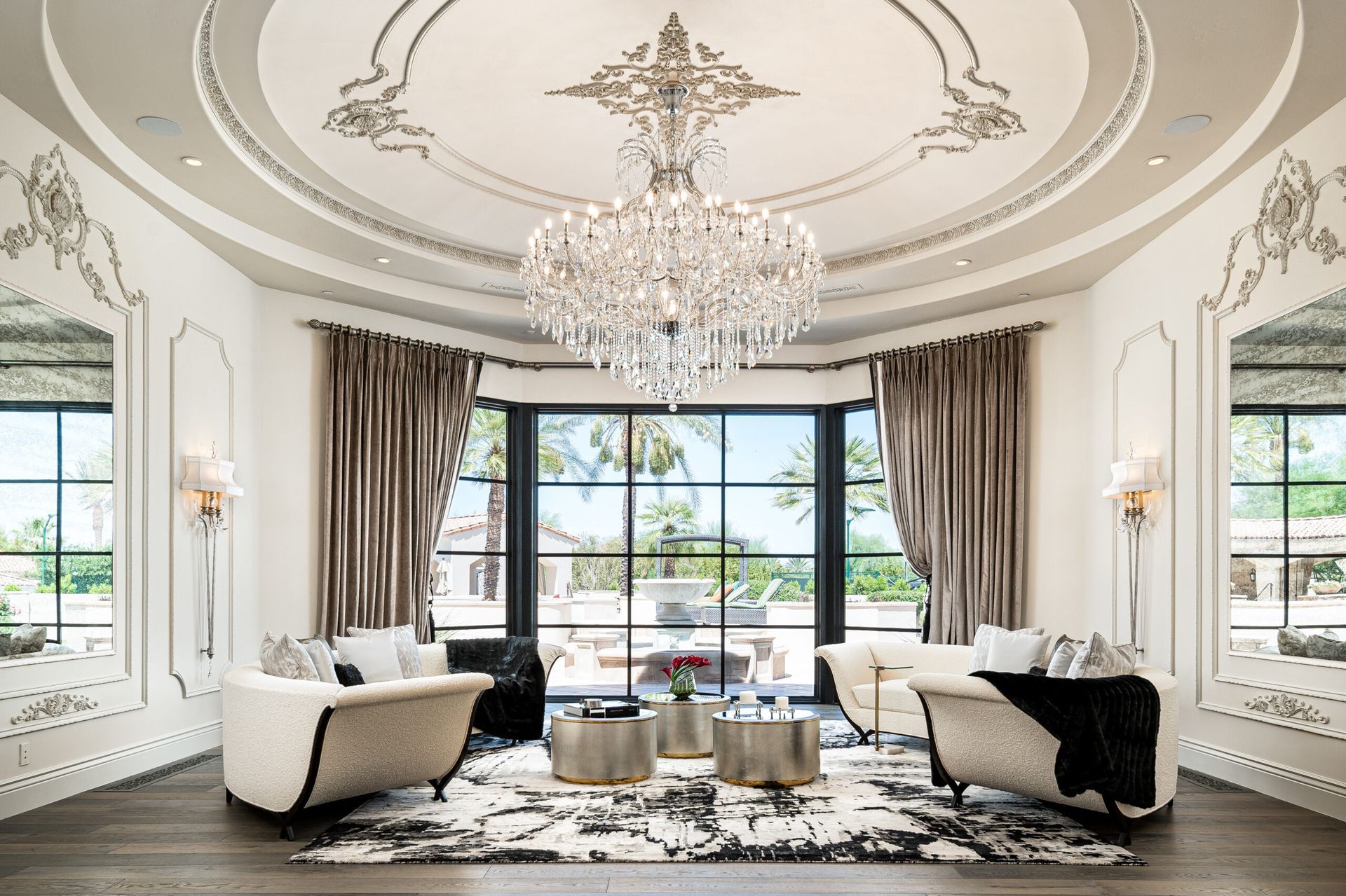 A living room filled with furniture and a chandelier.