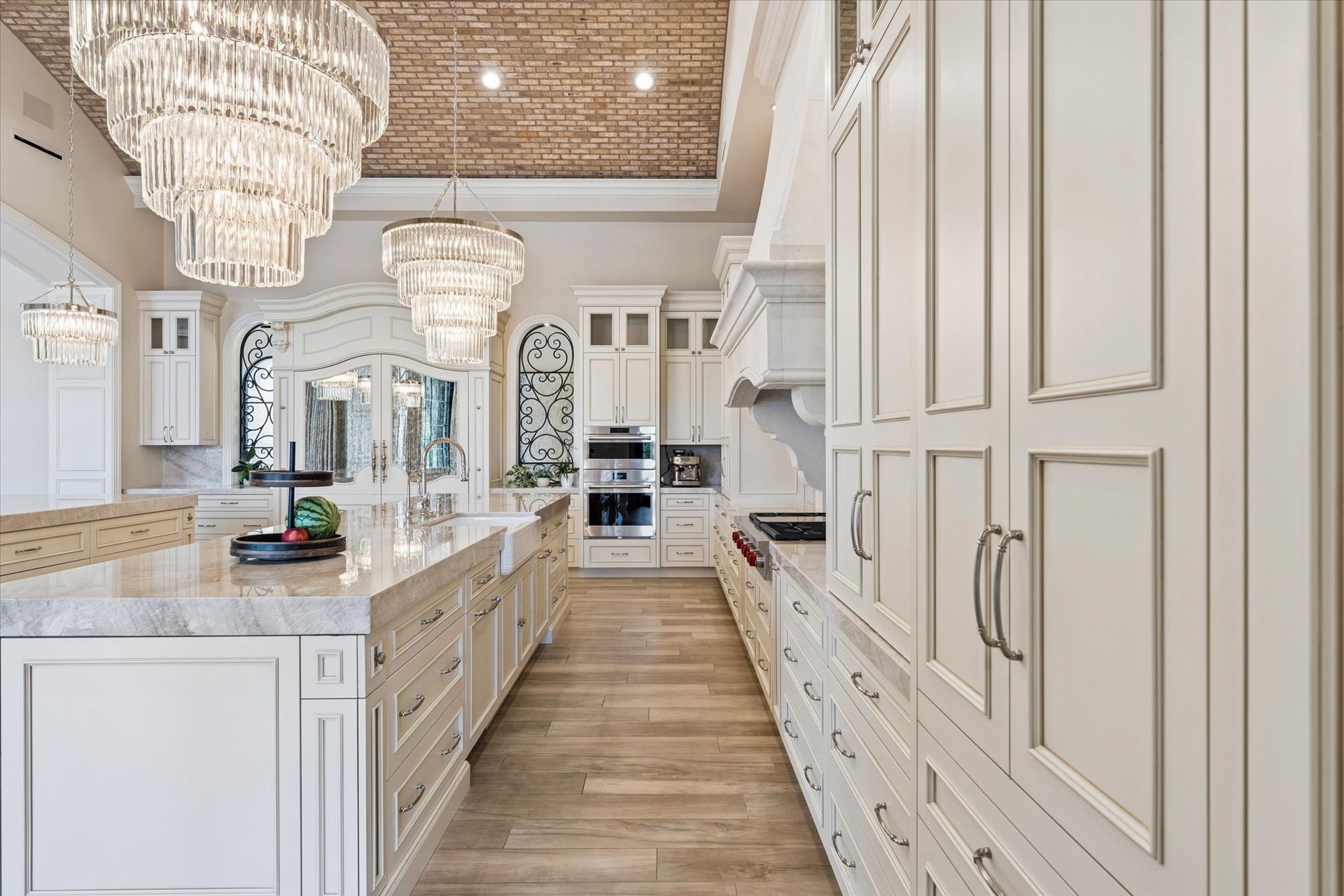 Luxury modern French kitchen with dual islands and a hidden fridge design