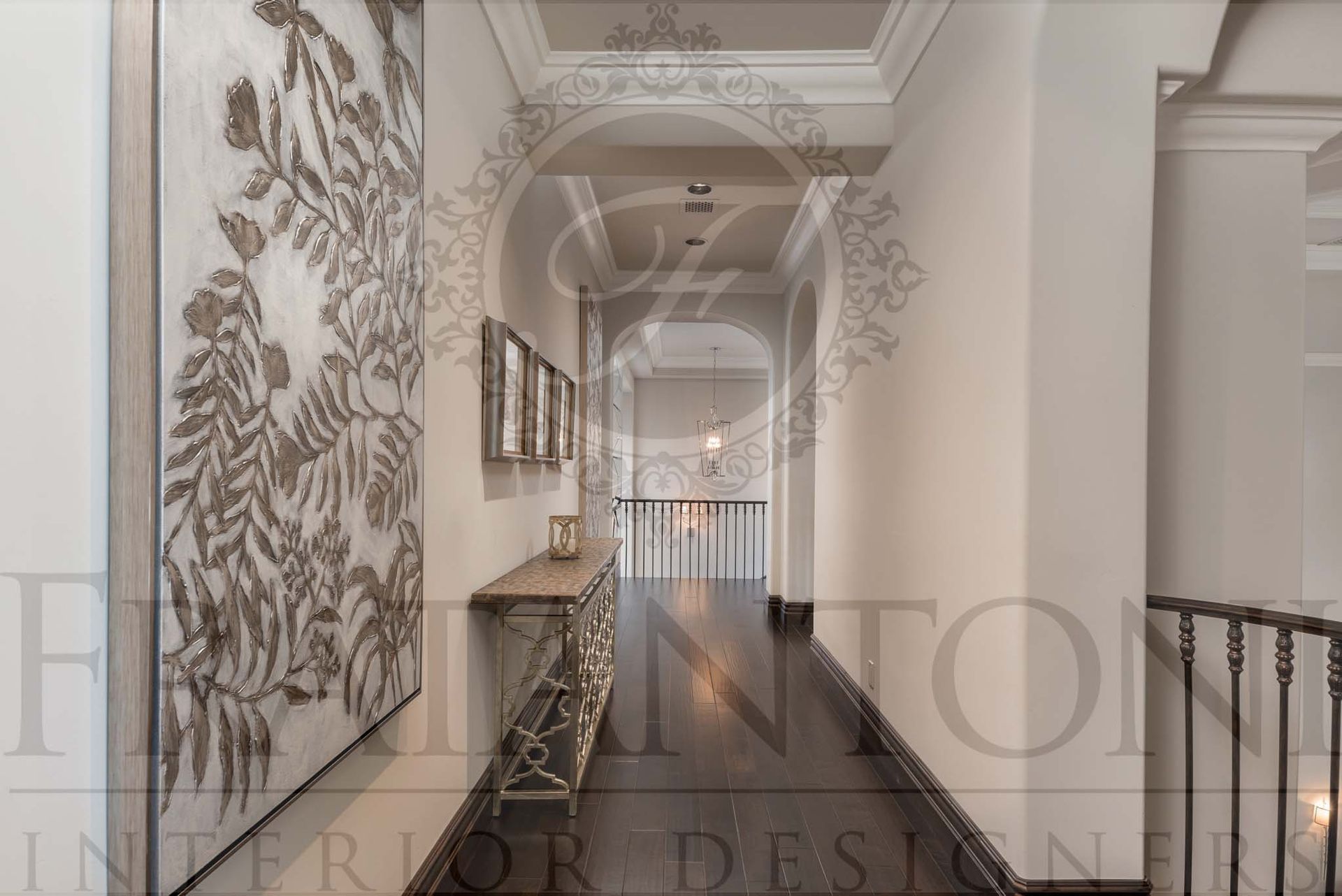Elegant hallway with ornate wall art, white coffered ceiling details, and dark wooden floors.