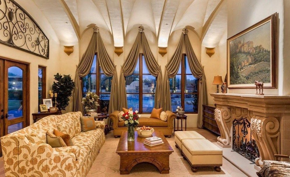 A living room filled with furniture and a fireplace