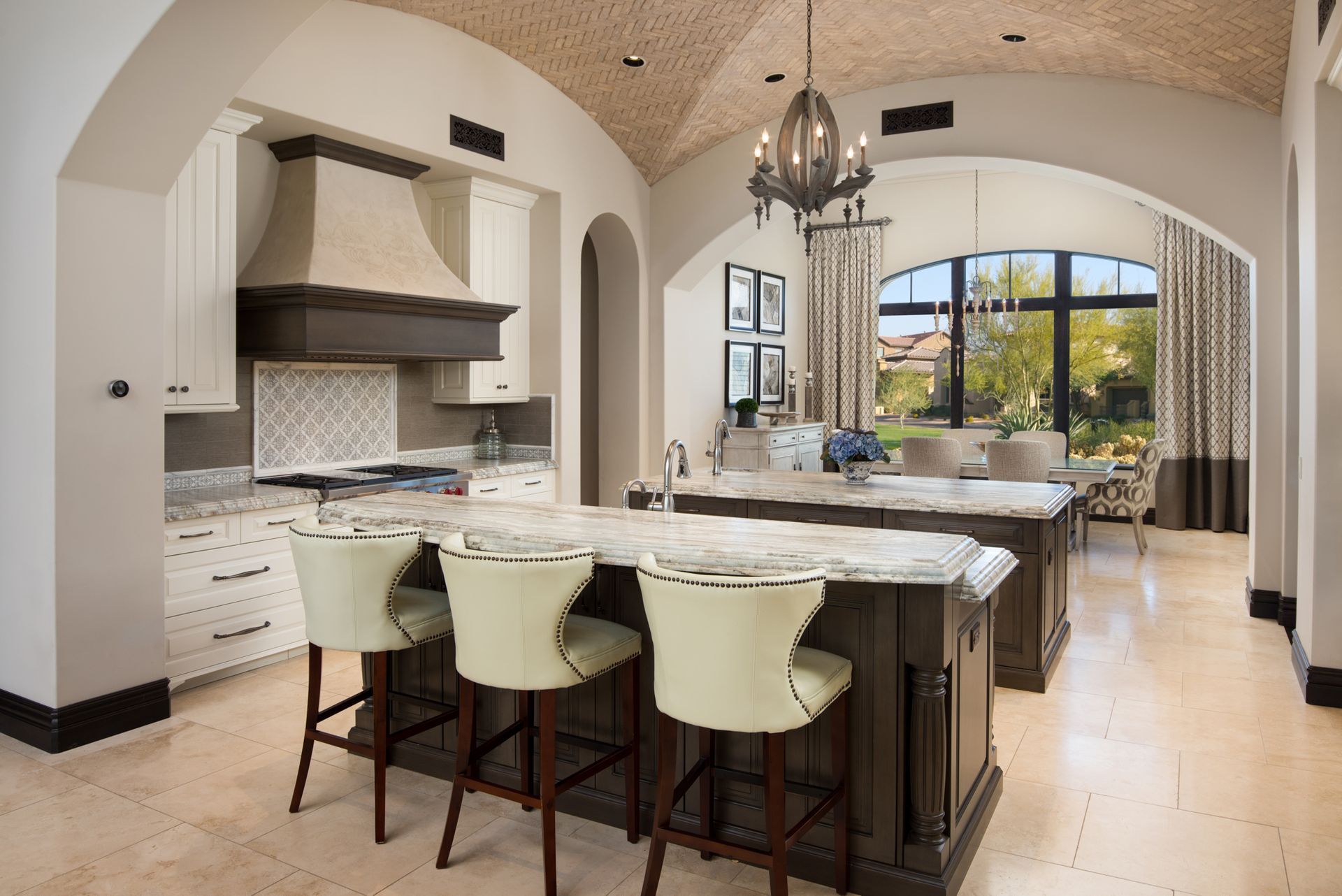 A kitchen with a large island and stools