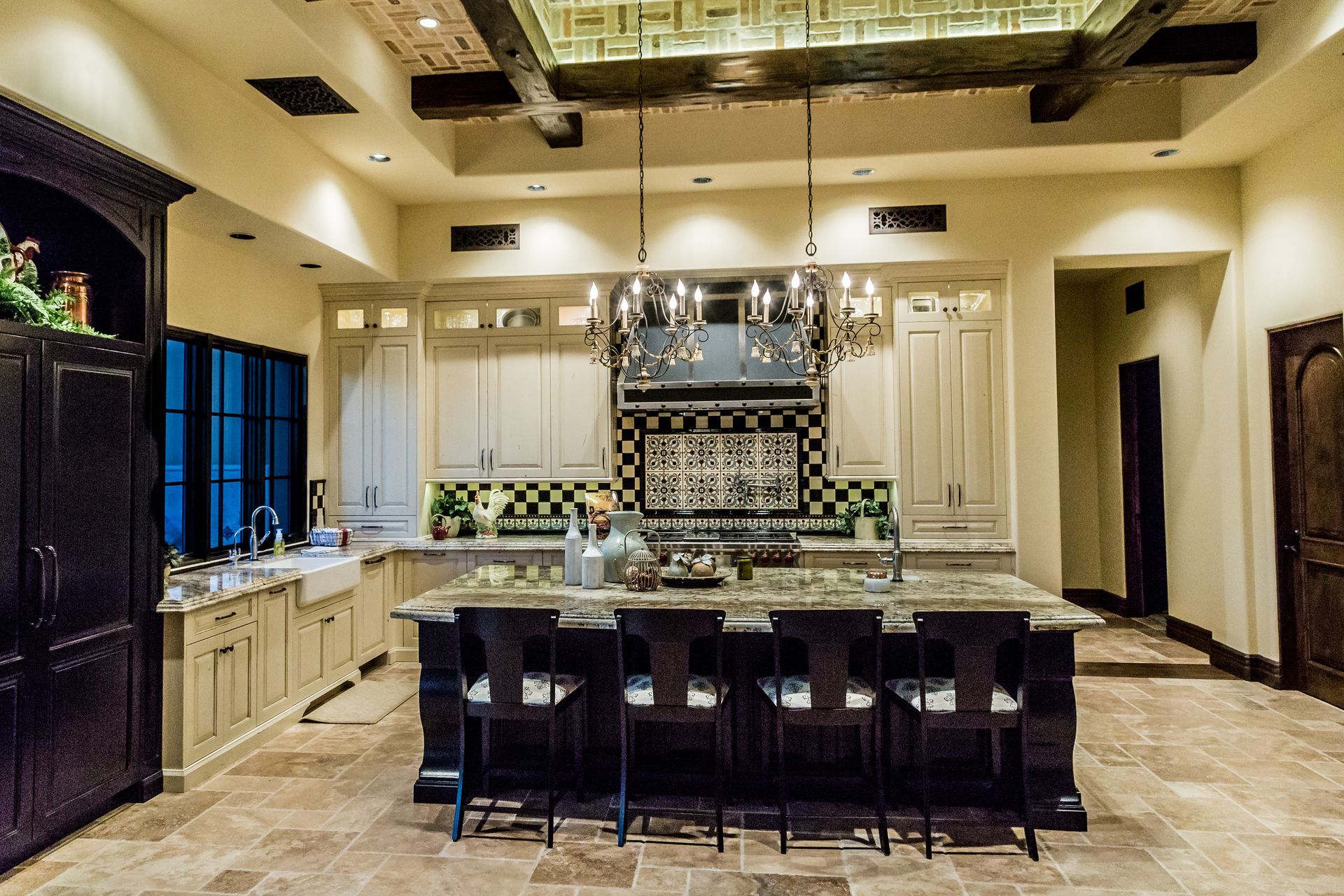 A large kitchen with a large island in the middle