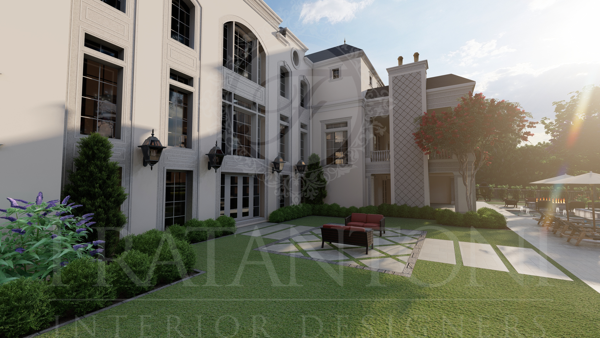 Immaculate manicured mansion courtyard with white exterior, green lawn, geometric pavers, custom patio furniture, lanterns, sconces, and trees