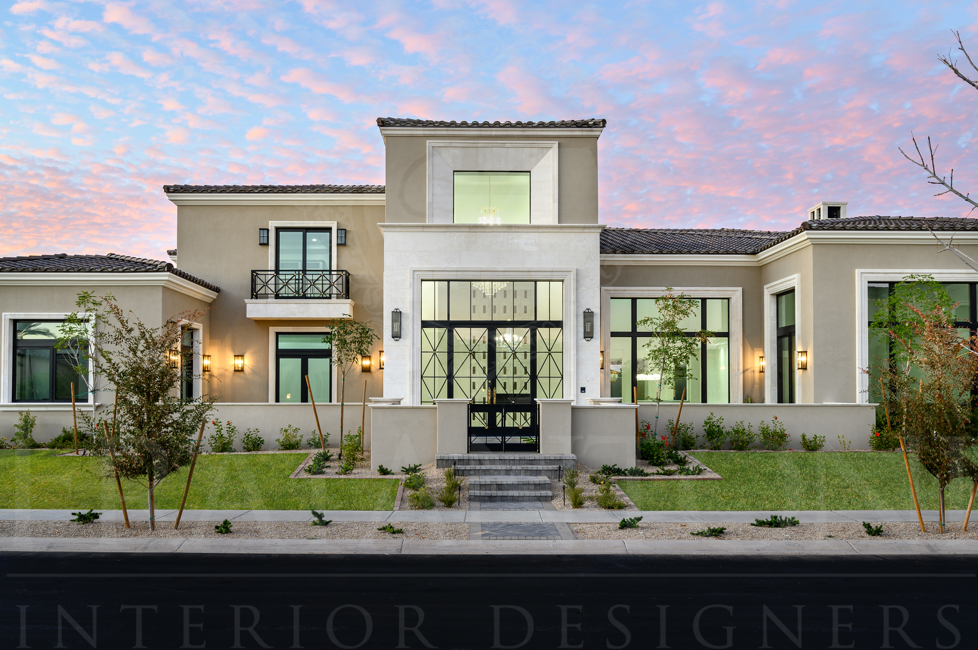 Modern luxury house exterior at dusk with landscaped front yard and pastel sky in Scottsdale, Arizona