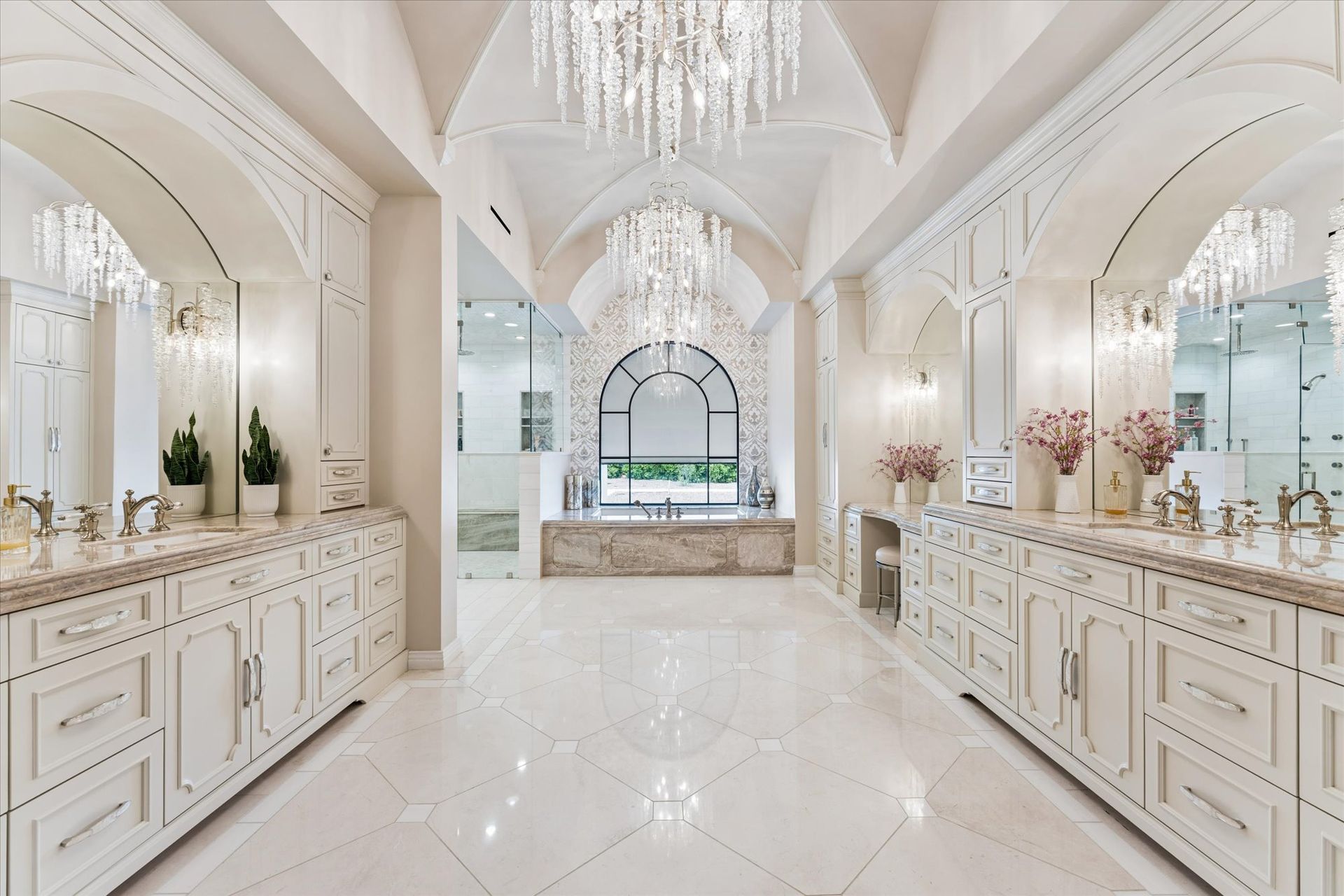 Luxury modern French bathroom with three vanities and custom cabinetry