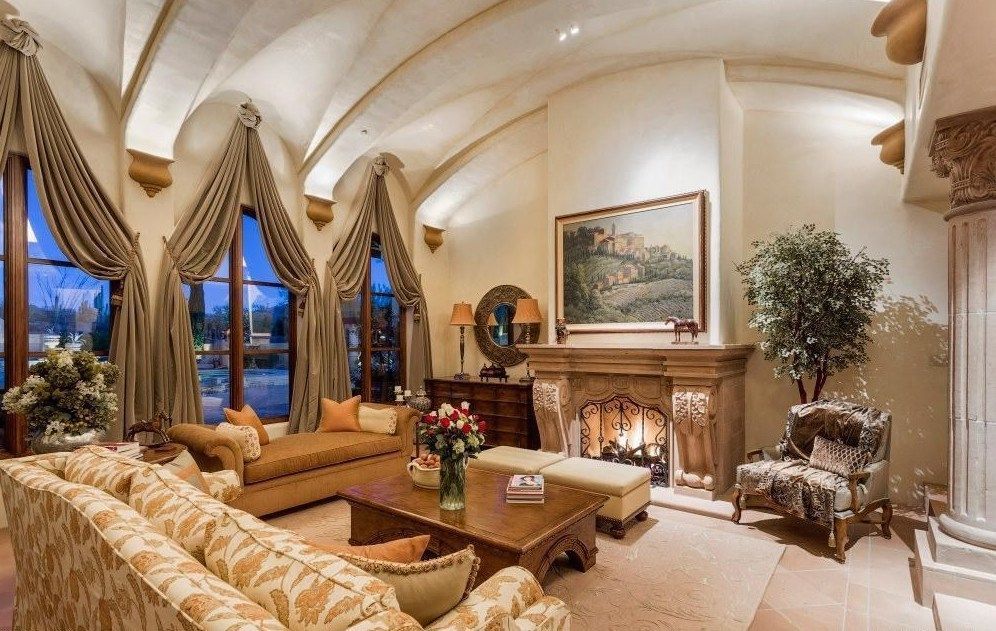 A living room filled with furniture and a fireplace