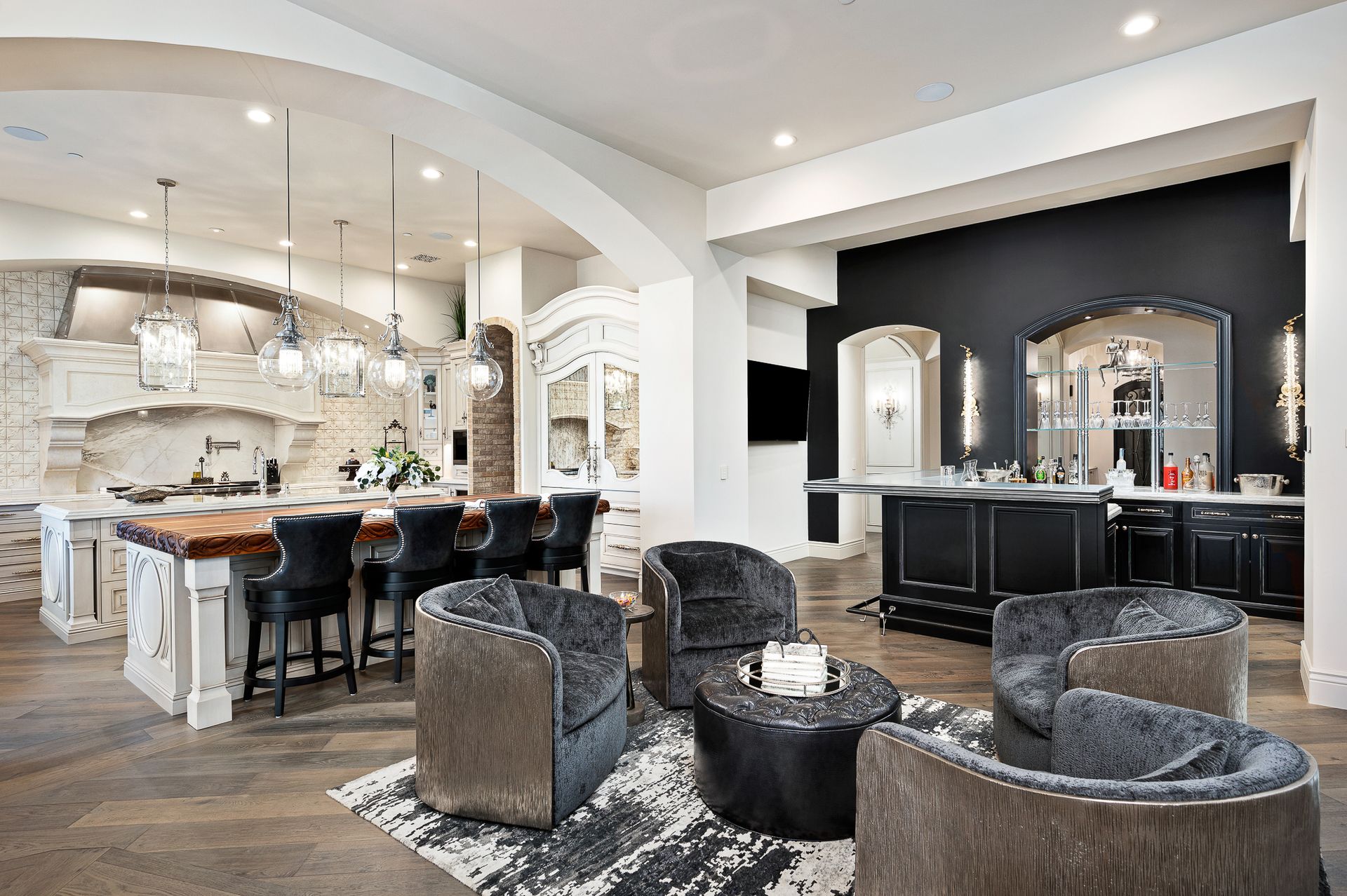 French luxurious open-concept kitchen and lounge area. Dual island kitchen with open-concept design and bar custom bar.