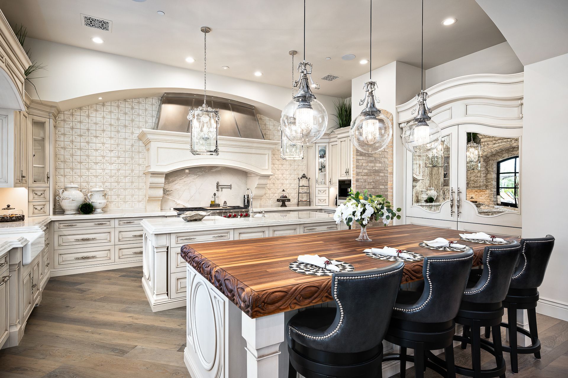 Old world European luxurious kitchen design with dual islands and transitional style