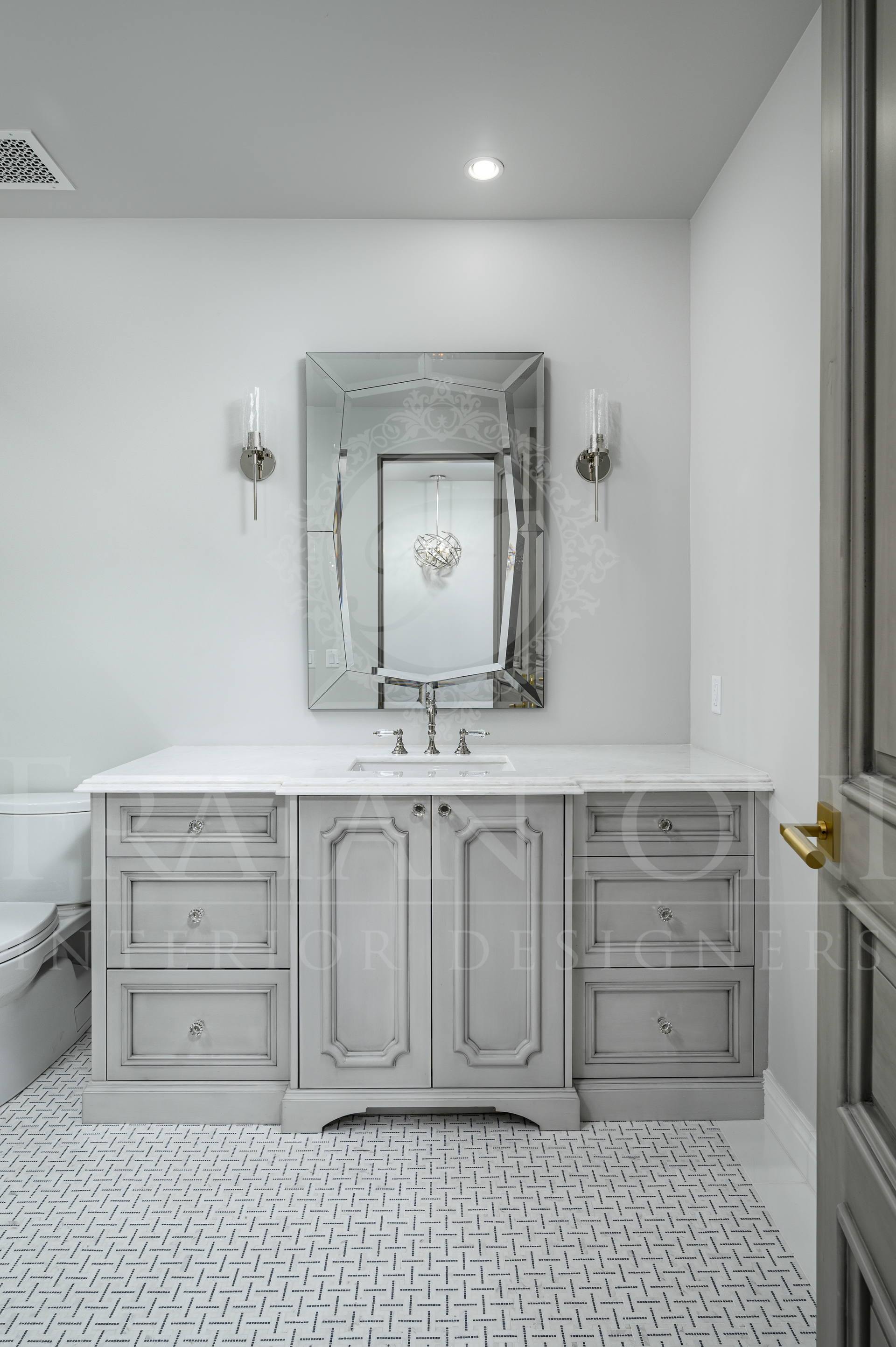 Custom luxury grey bathroom vanity with mirror, wall sconces, and patterned marble tile floor in scottsdale, arizona