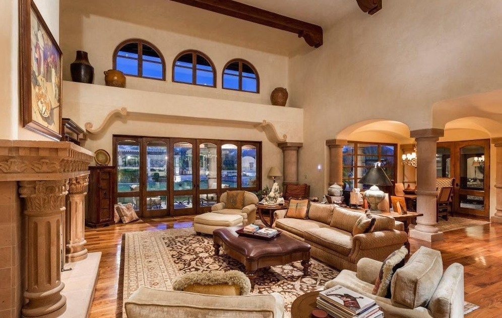 A living room filled with furniture and a fireplace