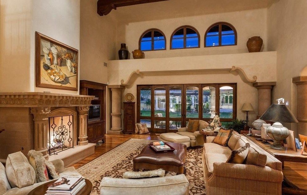 A living room filled with furniture and a fireplace