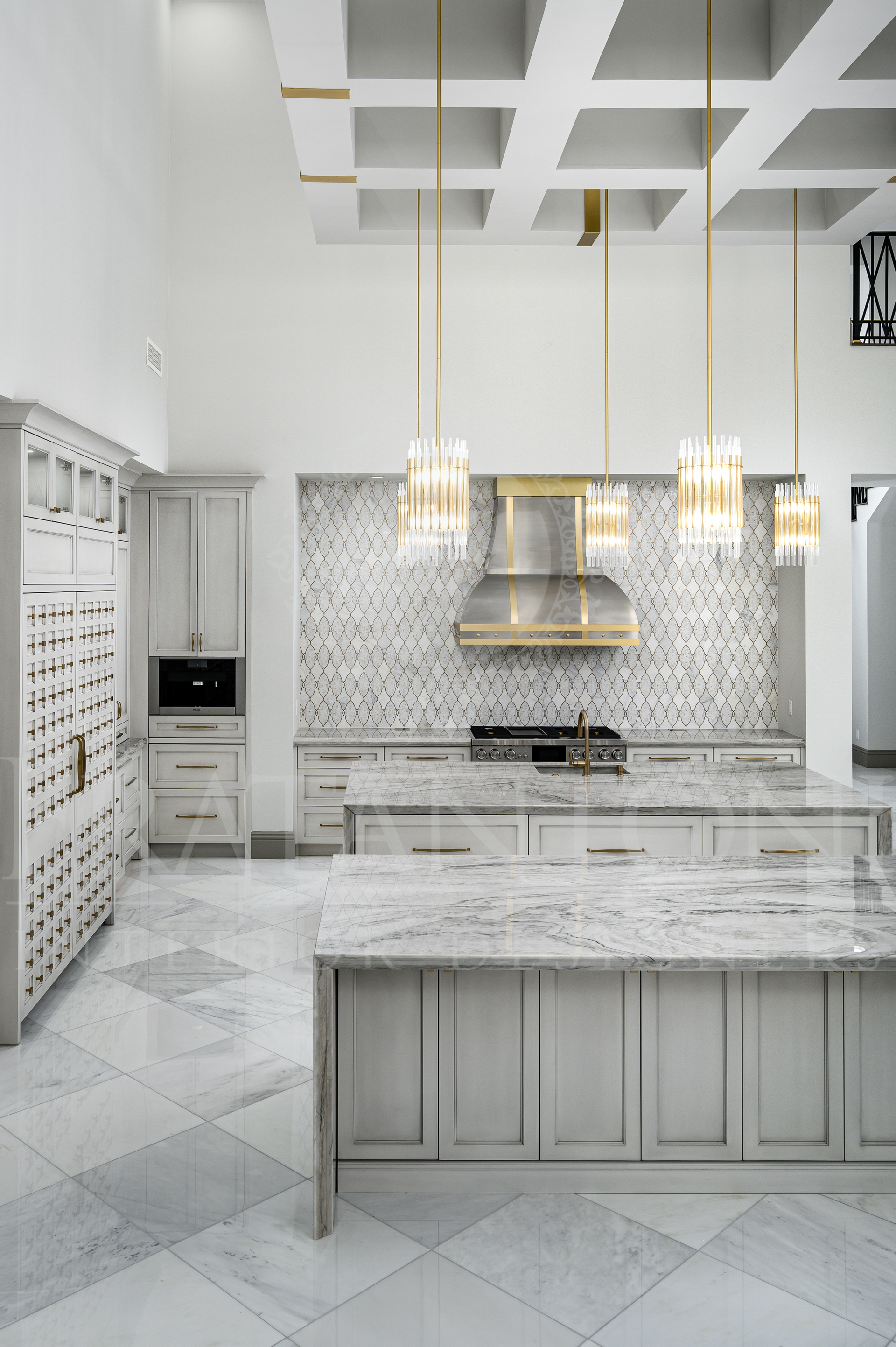 Luxury kitchen with marble island, gold pendant lights, and stainless steel appliances in Scottsdale, Arizona.