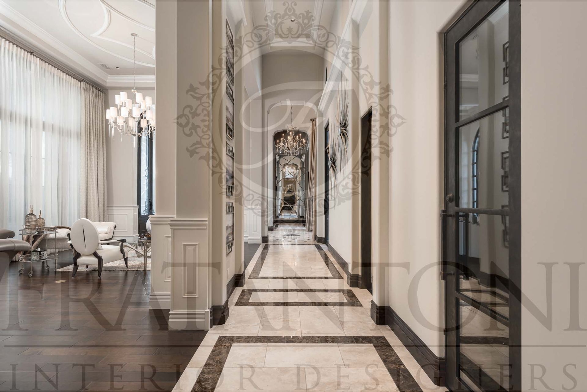 Elegant hallway with marble floors, tall windows, and ornate chandeliers in a bright luxury interior designed by Fratantoni Interior Designers