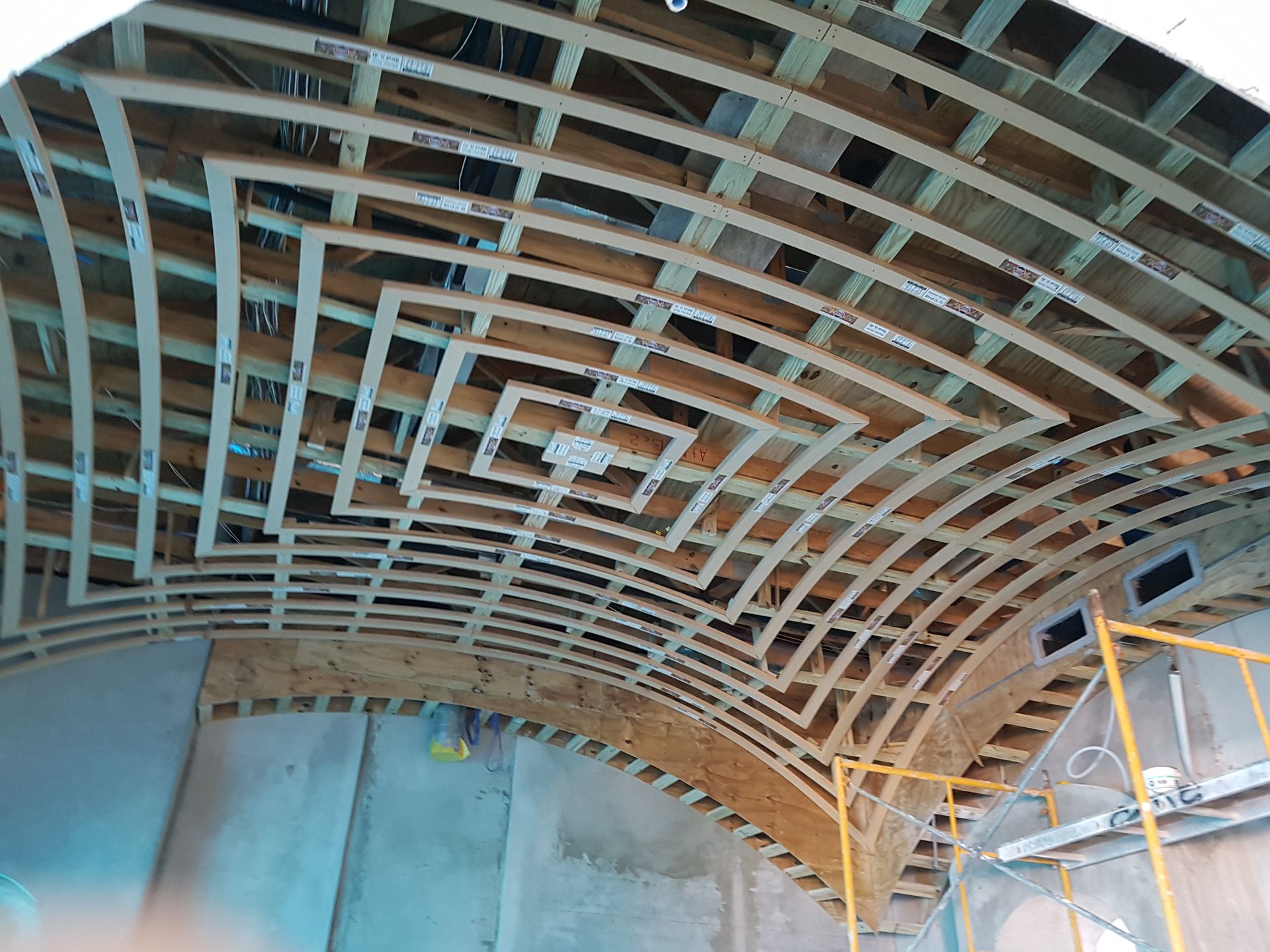 Wooden framework for a curved ceiling, with a square central design.