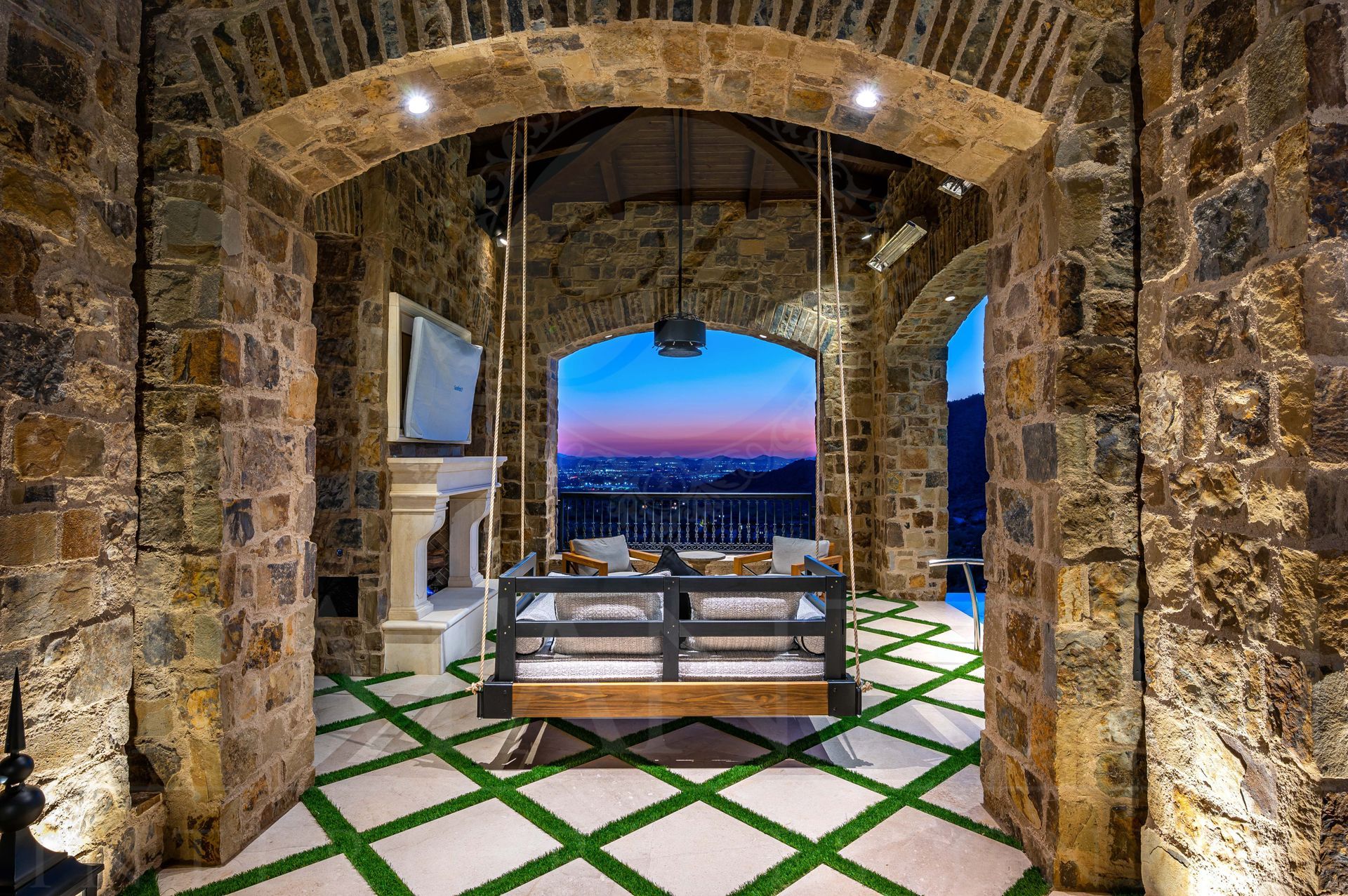 French luxury patio interior design with swing and stone arches by Fratantoni Interior Designers in scottsdale, Arizona