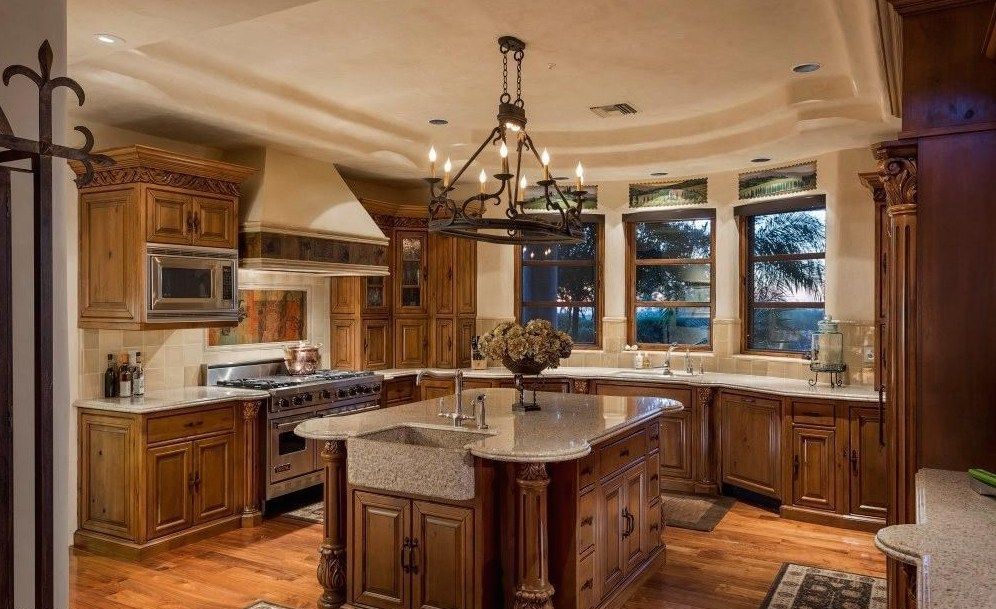 A large kitchen with a large island in the middle