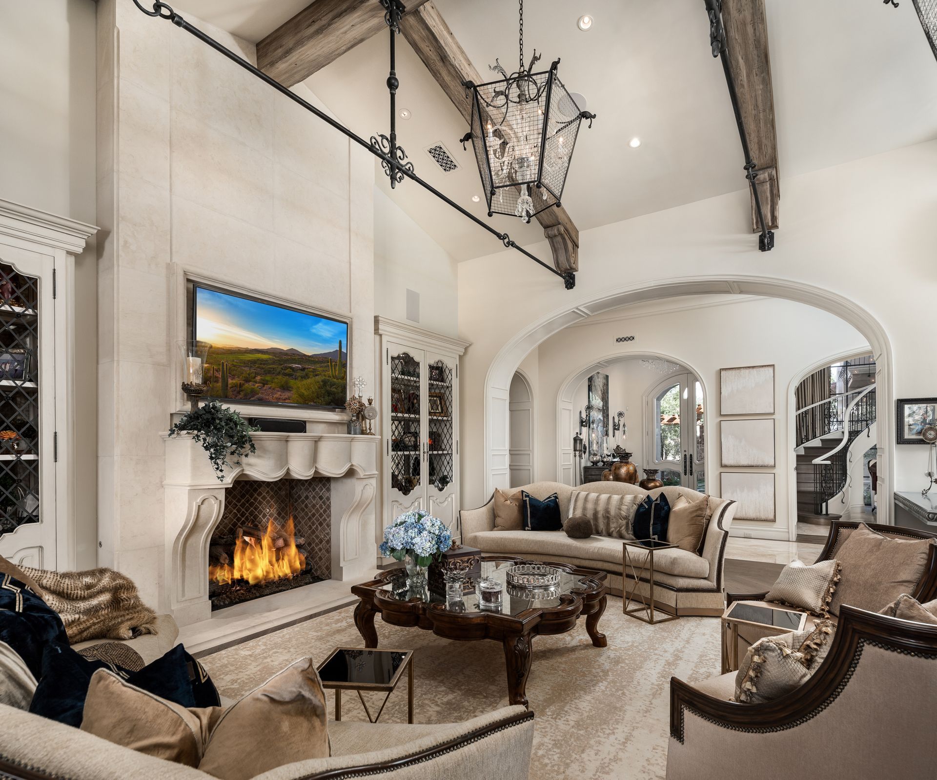 A living room with a fireplace and a flat screen tv