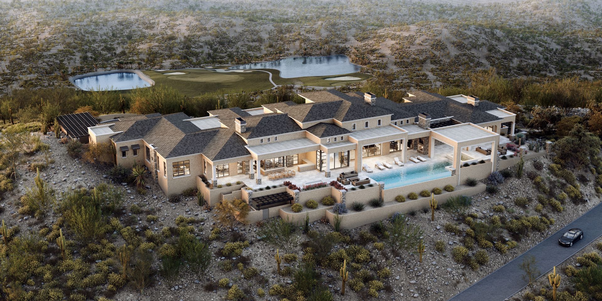 Aerial view of a large luxury house with a pool and surrounding arid landscape. A road and pond are visible nearby.