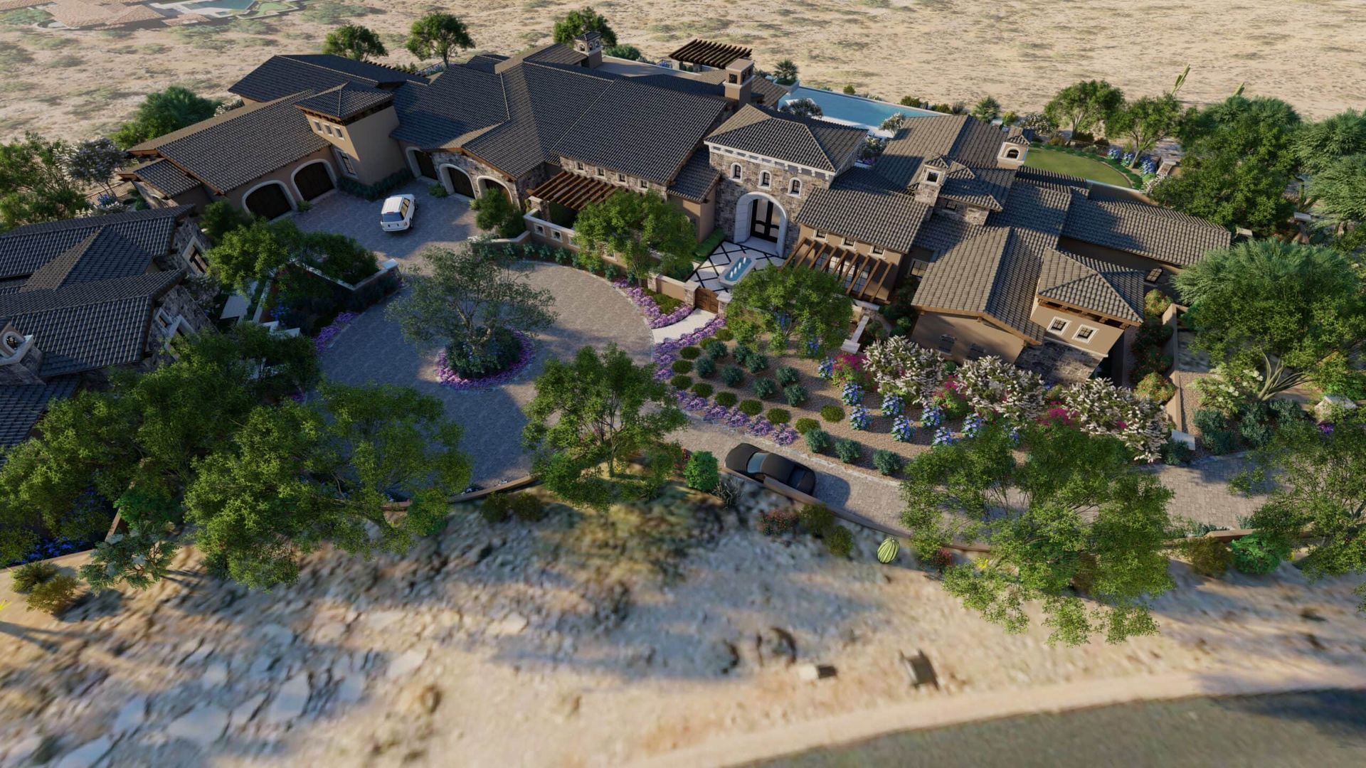 Aerial view of a large house with multiple wings, a pool, and landscaping in a desert setting.