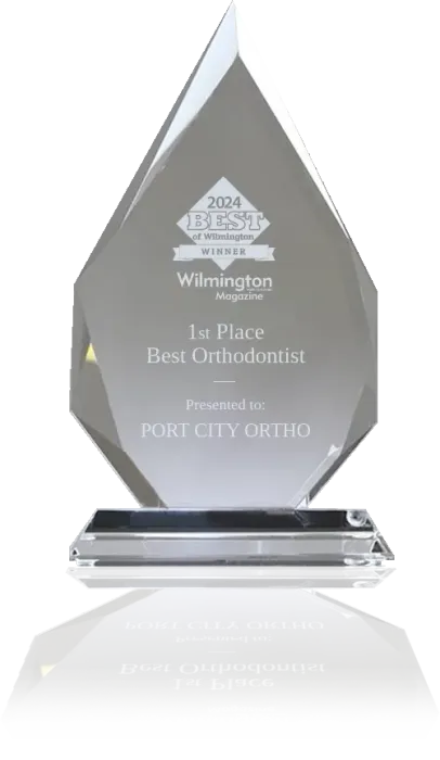 A crystal trophy that says