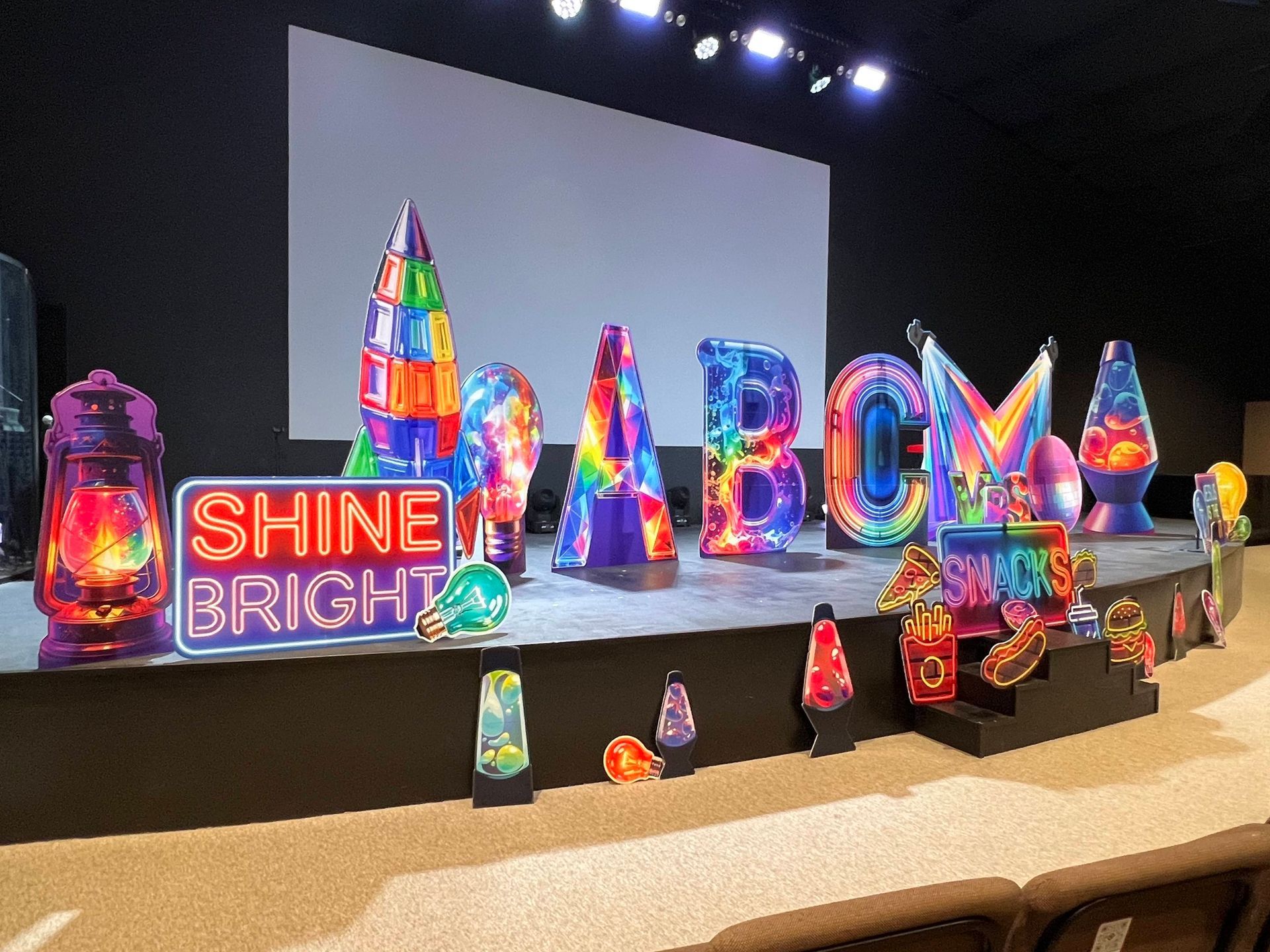 Stage set with colorful letters spelling 