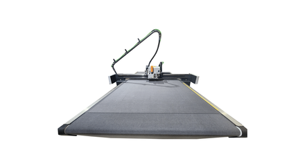 Large, industrial flatbed cutting machine; black, with conveyor belt and articulated arm.
