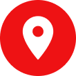 A white pin in a red circle on a white background.