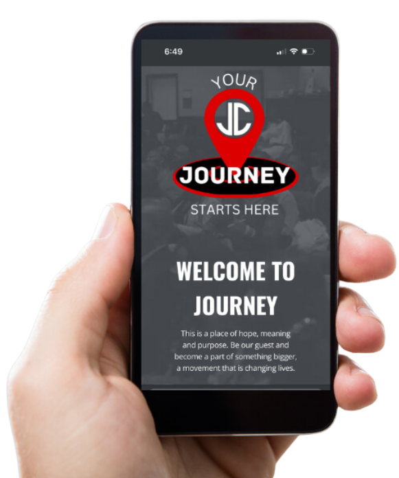 A hand is holding a cell phone that says welcome to journey