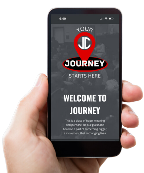 A hand is holding a cell phone that says welcome to journey