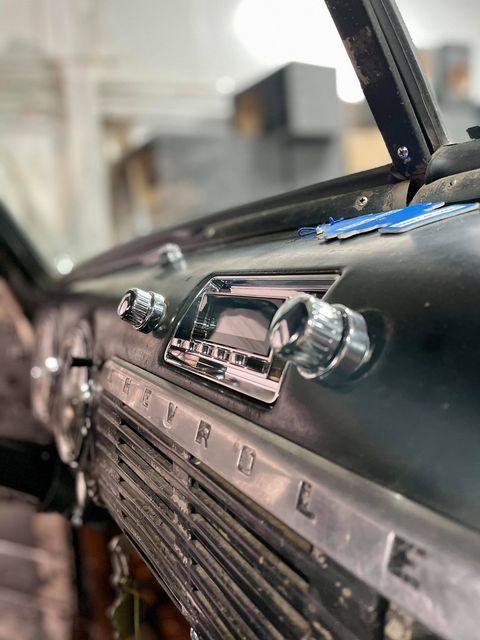 A close up of the dashboard of an old ford truck.