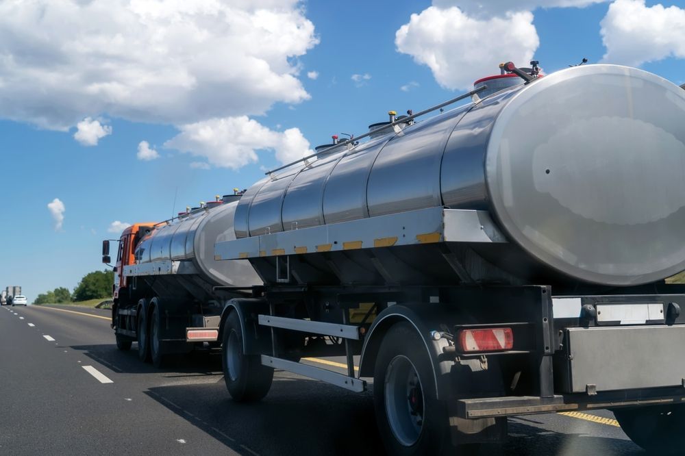 A Silver Tanker Truck Drives Along a Highway — Tamworth Water Cartage in Duri, NSW