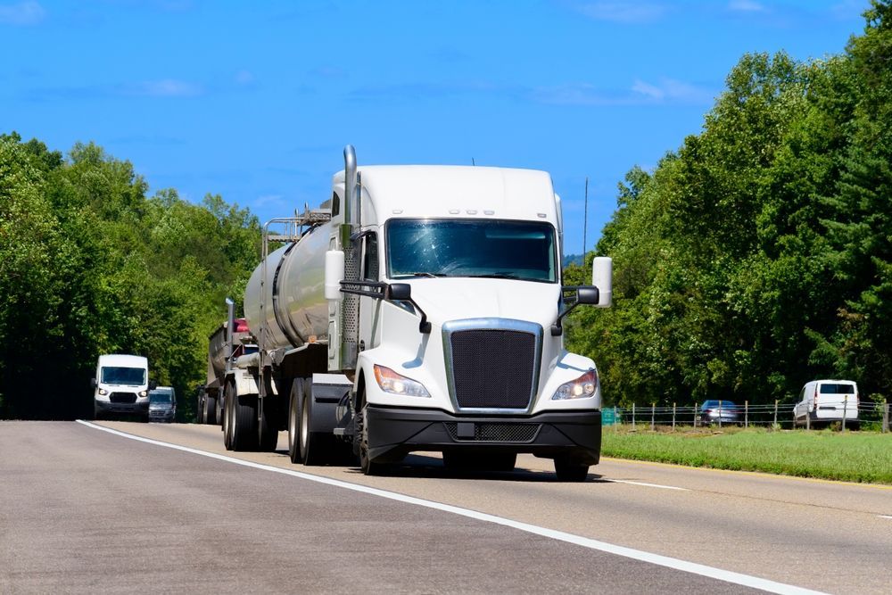 A White Tanker Truck Driving on a Multi-lane Highway — Tamworth Water Cartage in Quirindi, NSW