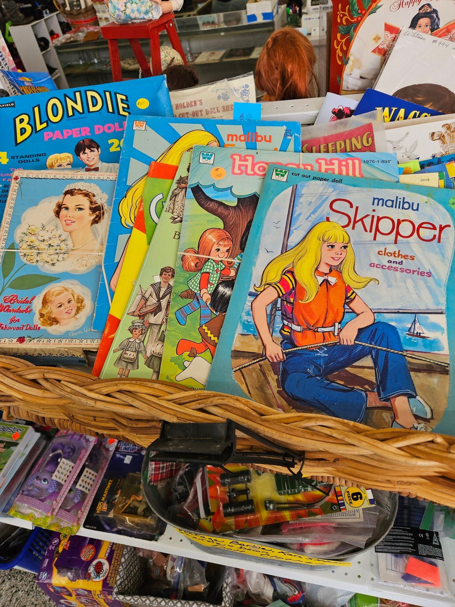 Basket of vintage comic books with colorful covers in a store display