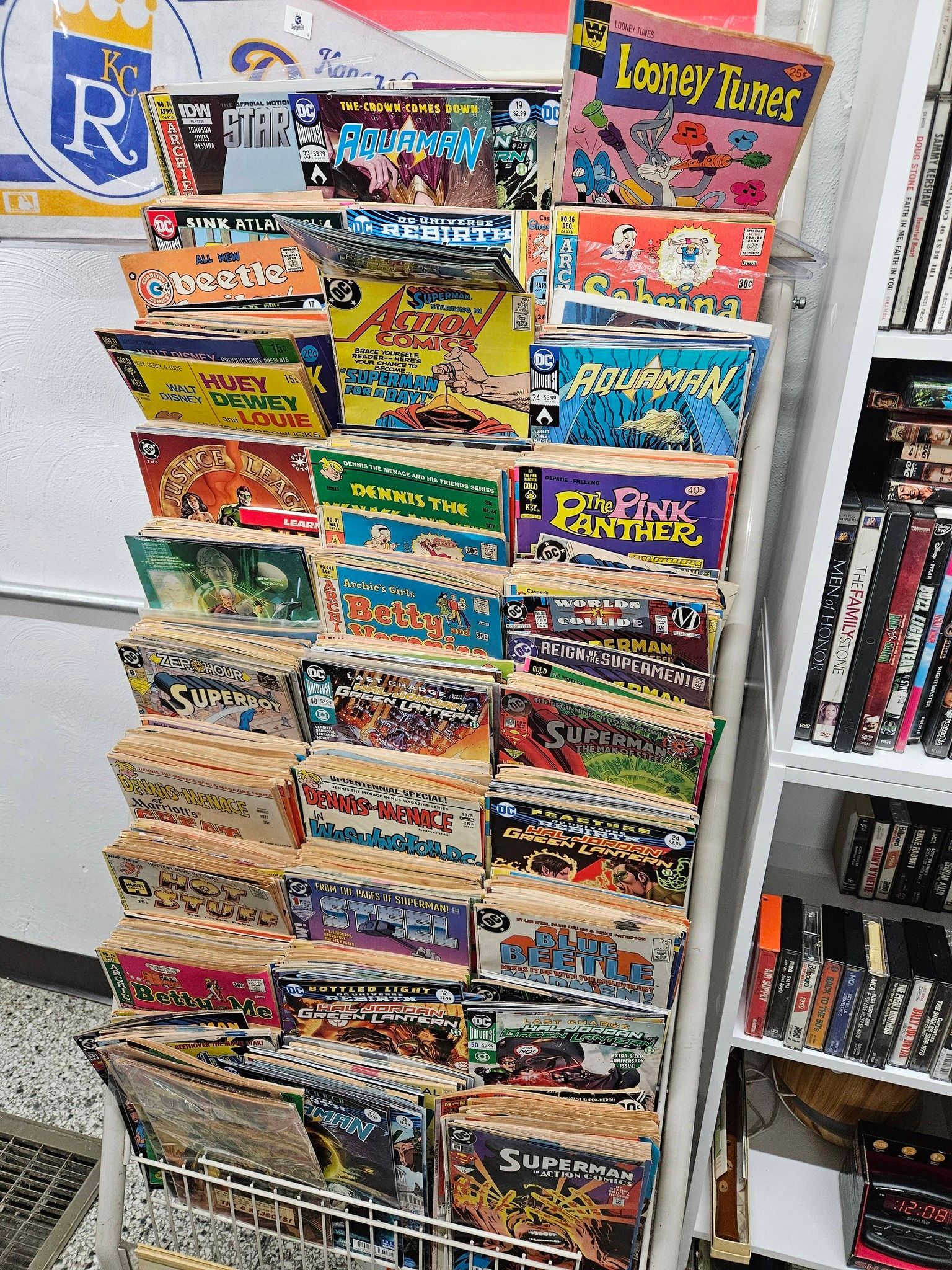 A store shelf packed with colorful cereal boxes, including Looney Tunes on the top right.