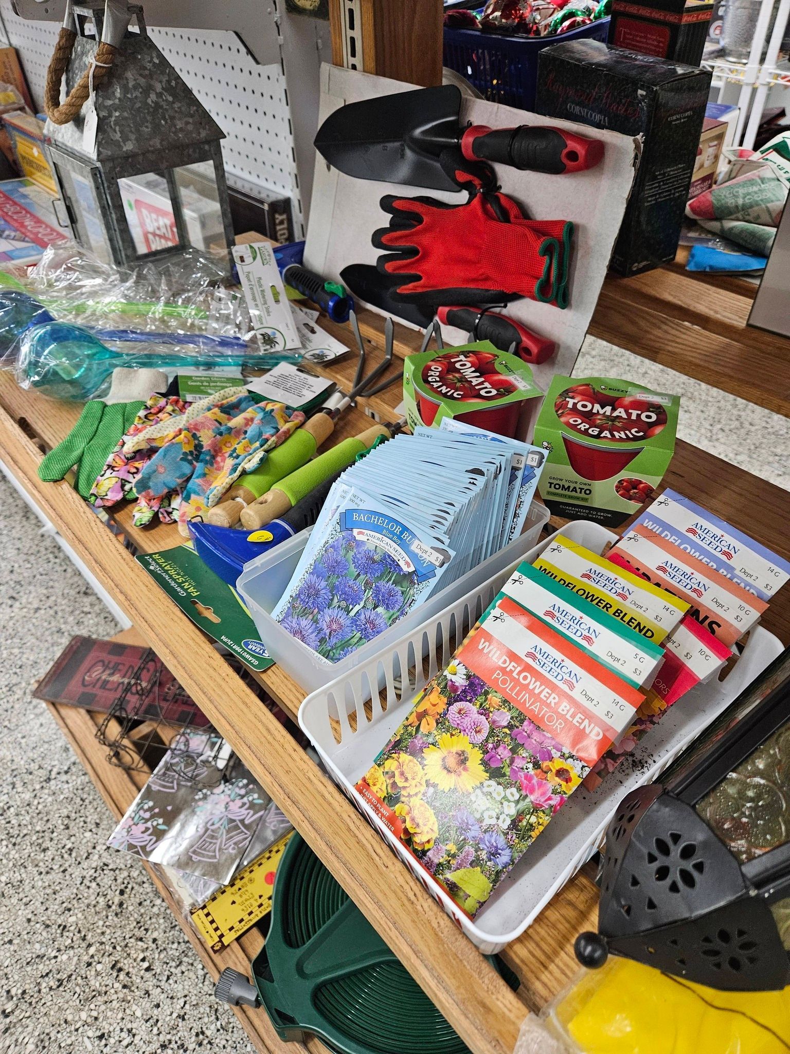 Colorful assortment of gift bags, cards, and small items on a retail display table