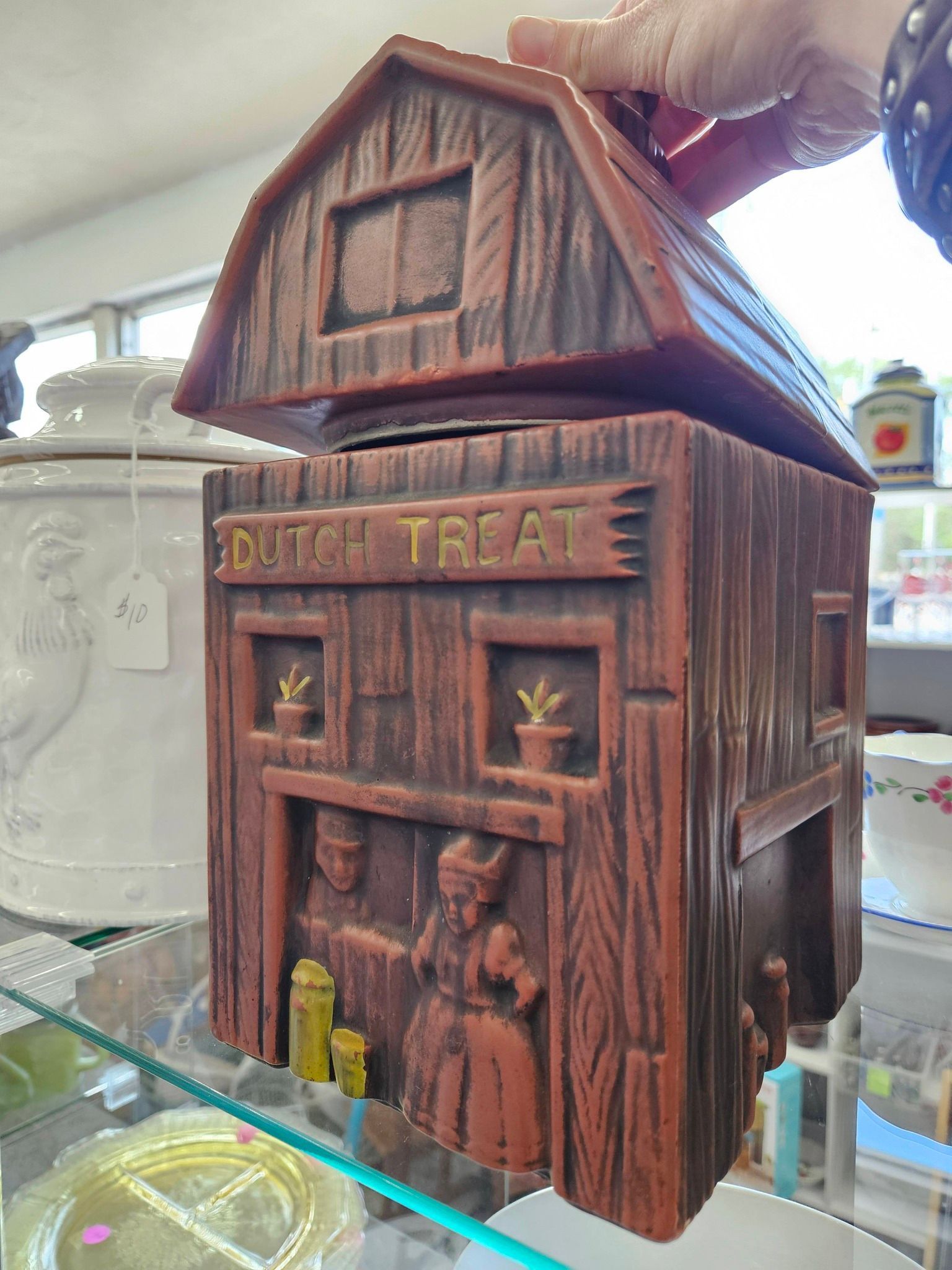 Wooden Halloween treat box with “DUTCH TREAT” sign and small decorative figures on the front.
