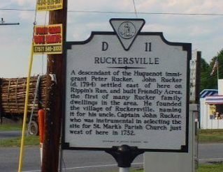 Keswick, VA logo with a red star over a gray Virginia silhouette Historical marker sign for Rockersville beside a roadside fence and utility pole.
