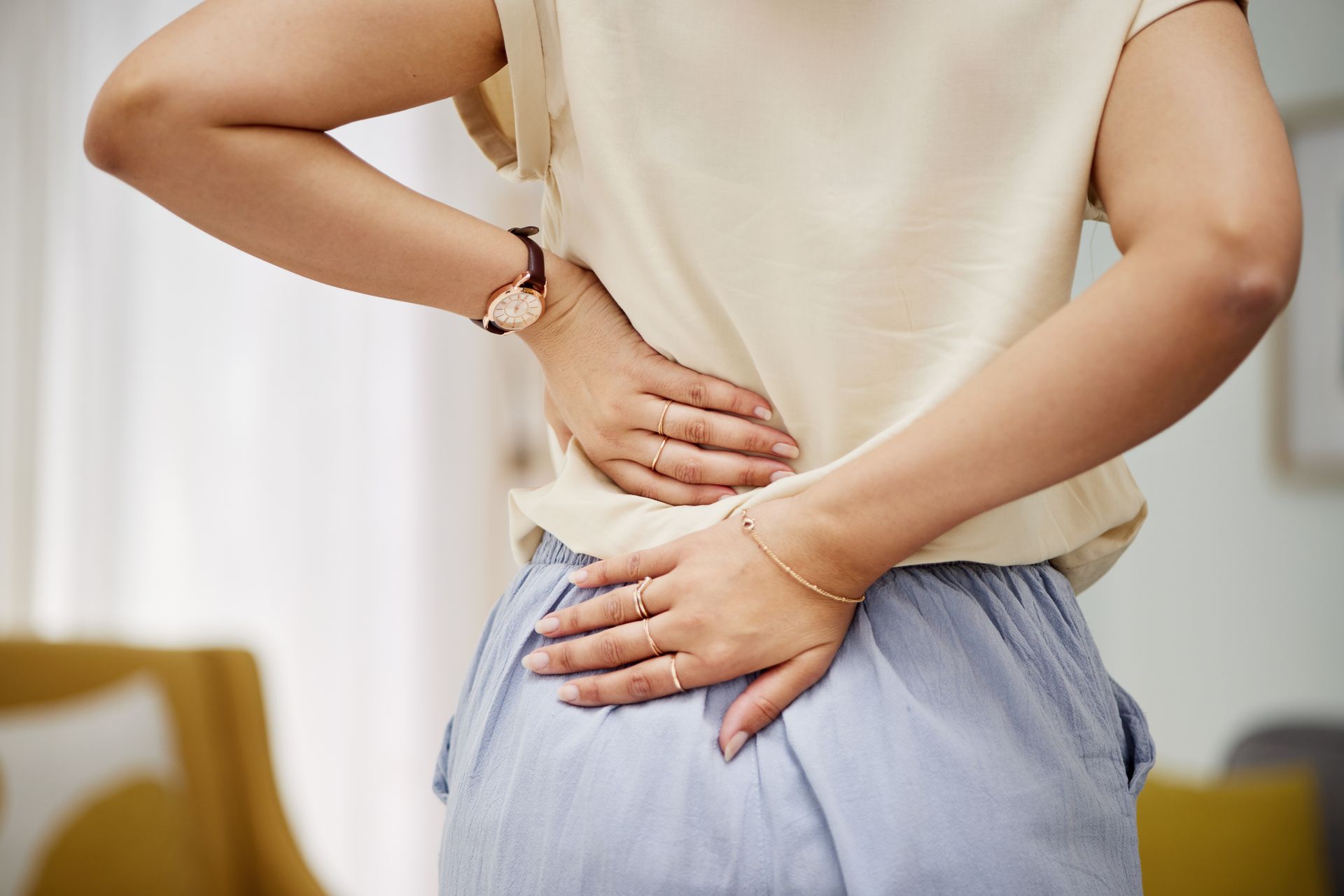A woman with sore back.
