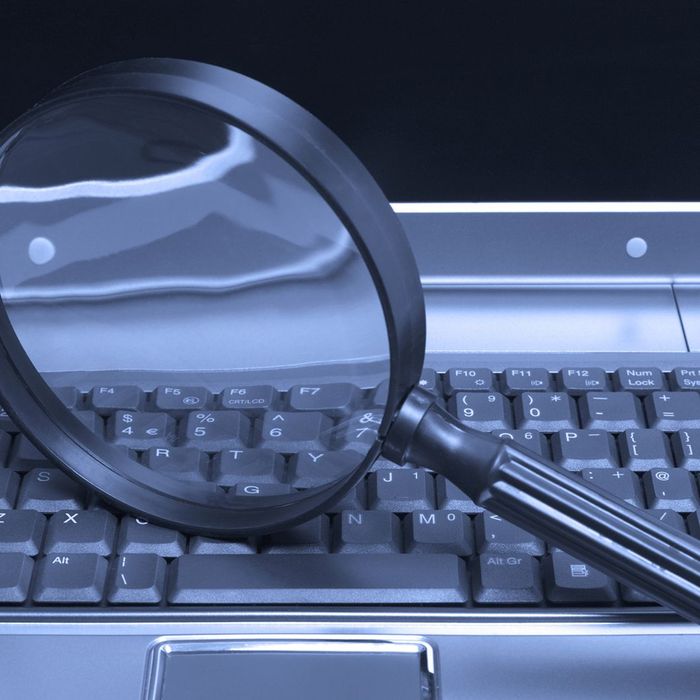 Laptop with magnifying glass
