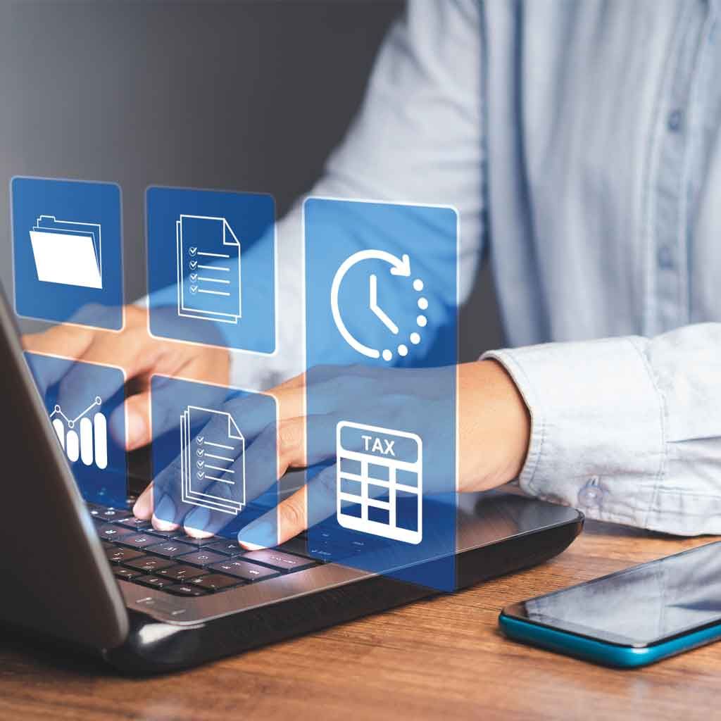 Person using laptop with digital icons overlaid.