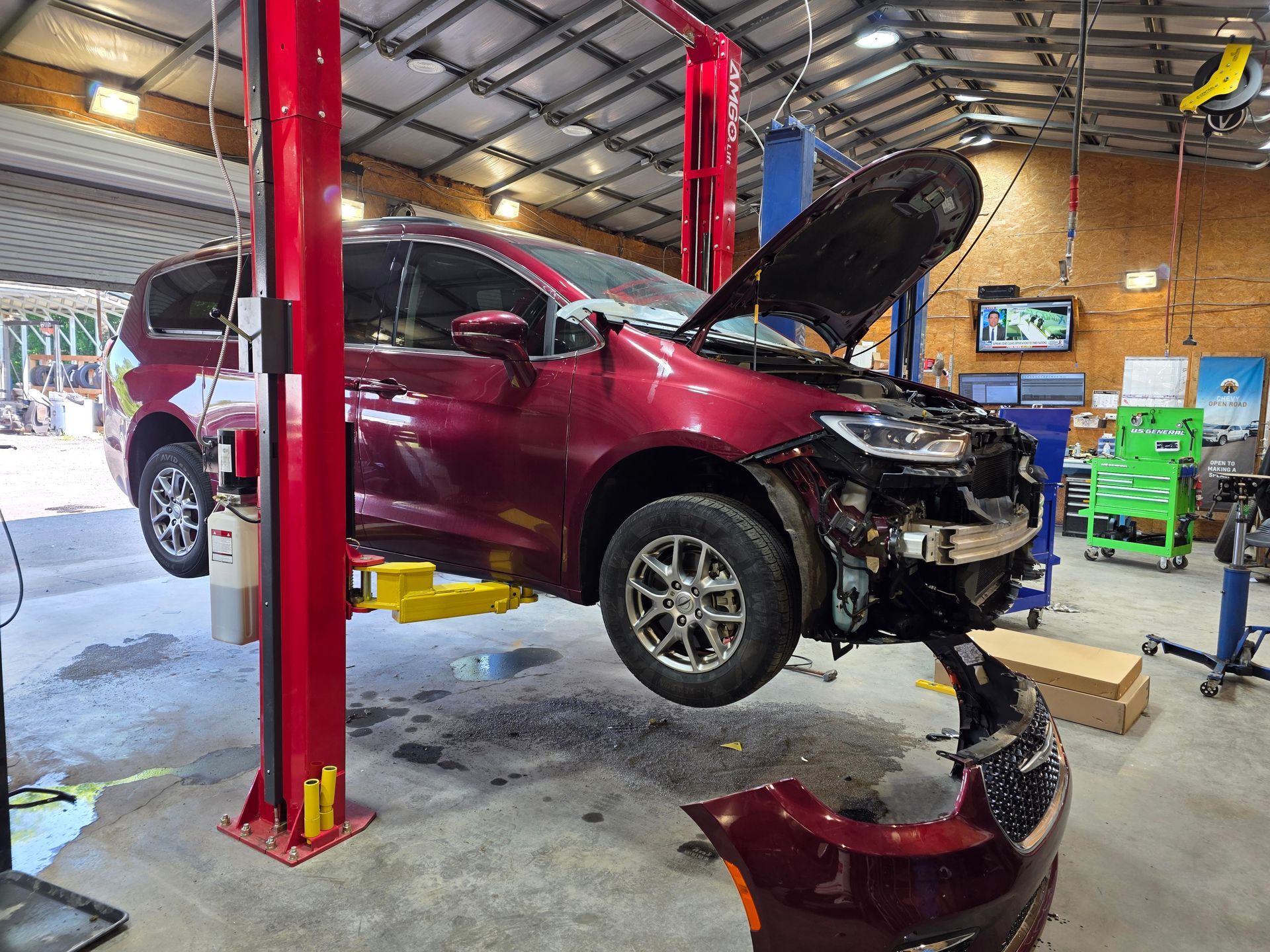 Mechanics Repairing Dirt Bikes | Masters Auto Group